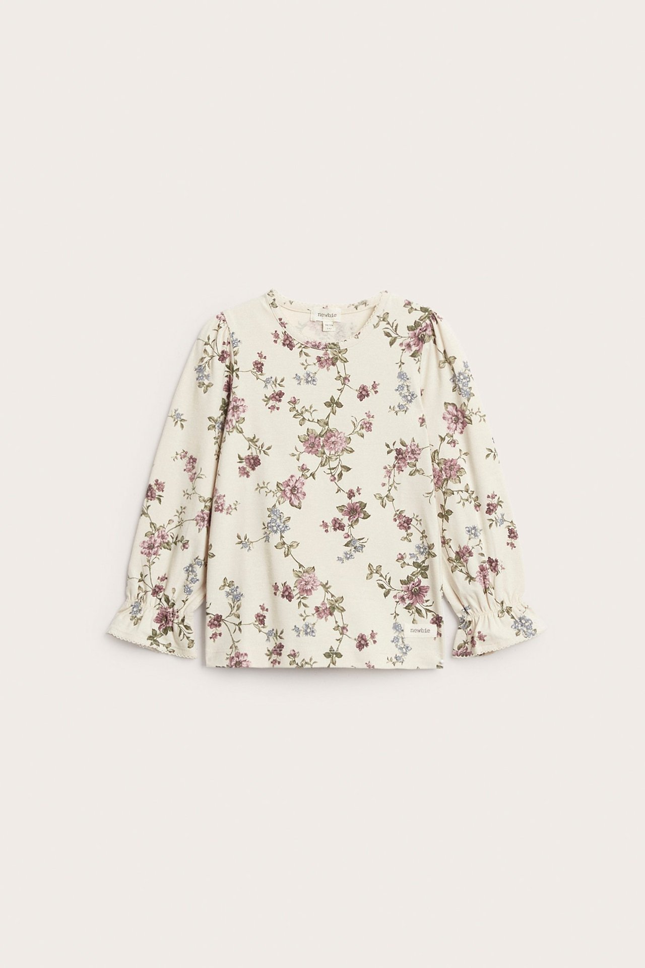 Frontvisning: Lys beige blomstret langermet topp med puffermer, elastiske rysjekanter og picot-kant.