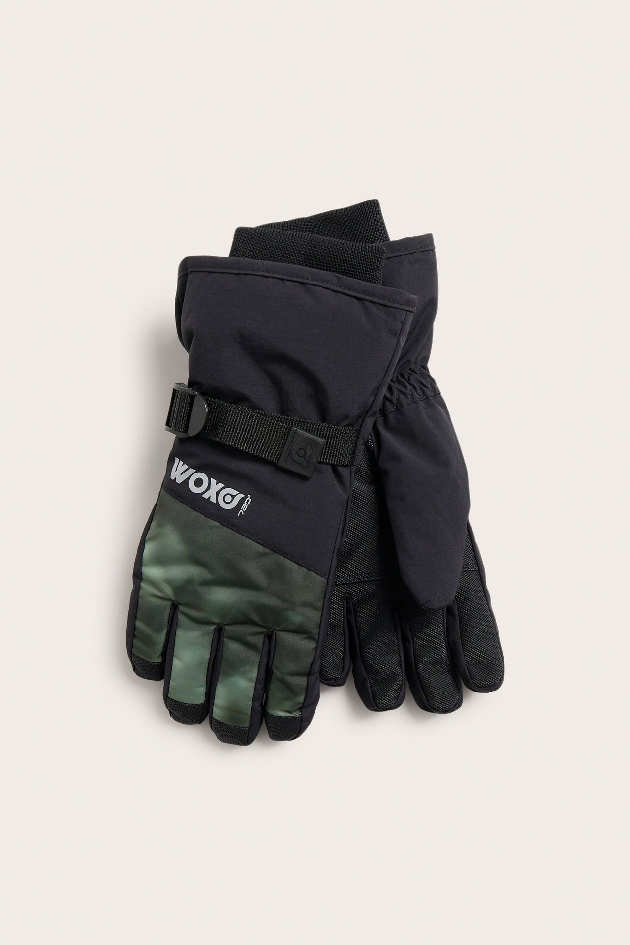 Edestä, parit mustat ja vihreät kuviolliset lasten lasketteluhanskat säädettävillä rannehihnoilla.