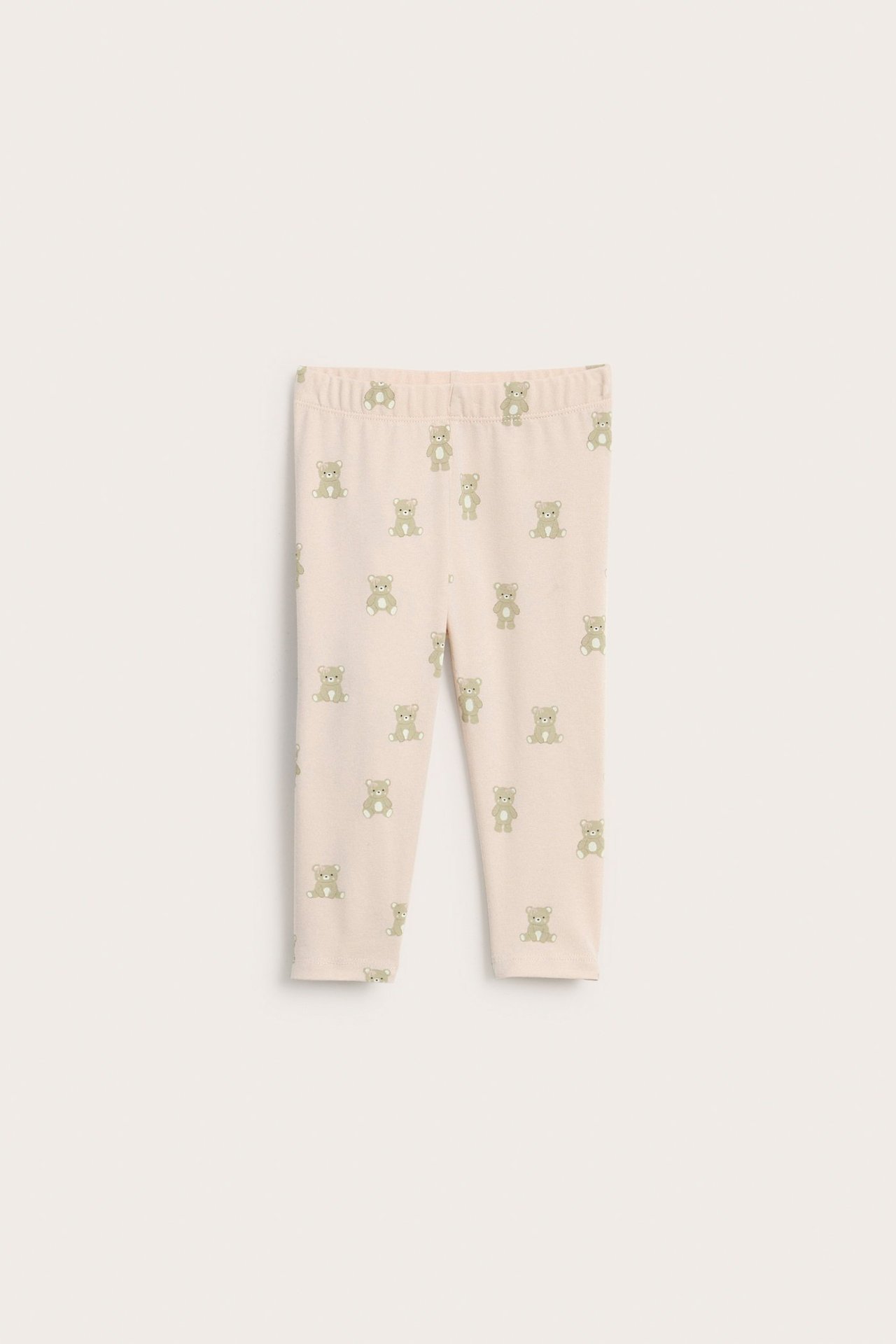 Forfra, lyserosa baby leggings med heldekkende grønt bamsemønster og elastisk midje.