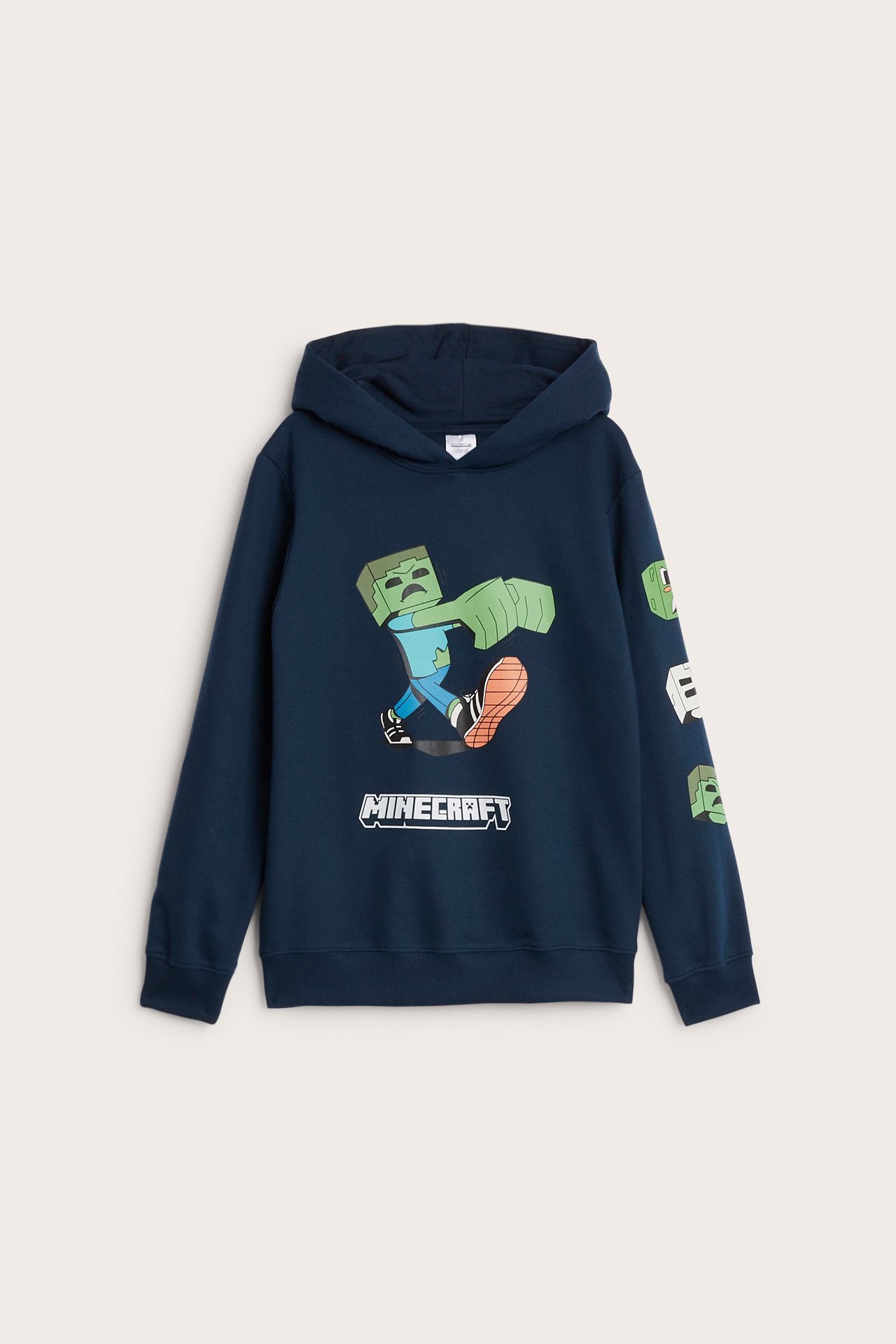 Frontvisning av en mørkeblå bomullshettegenser for barn med stort Minecraft zombie-trykk.