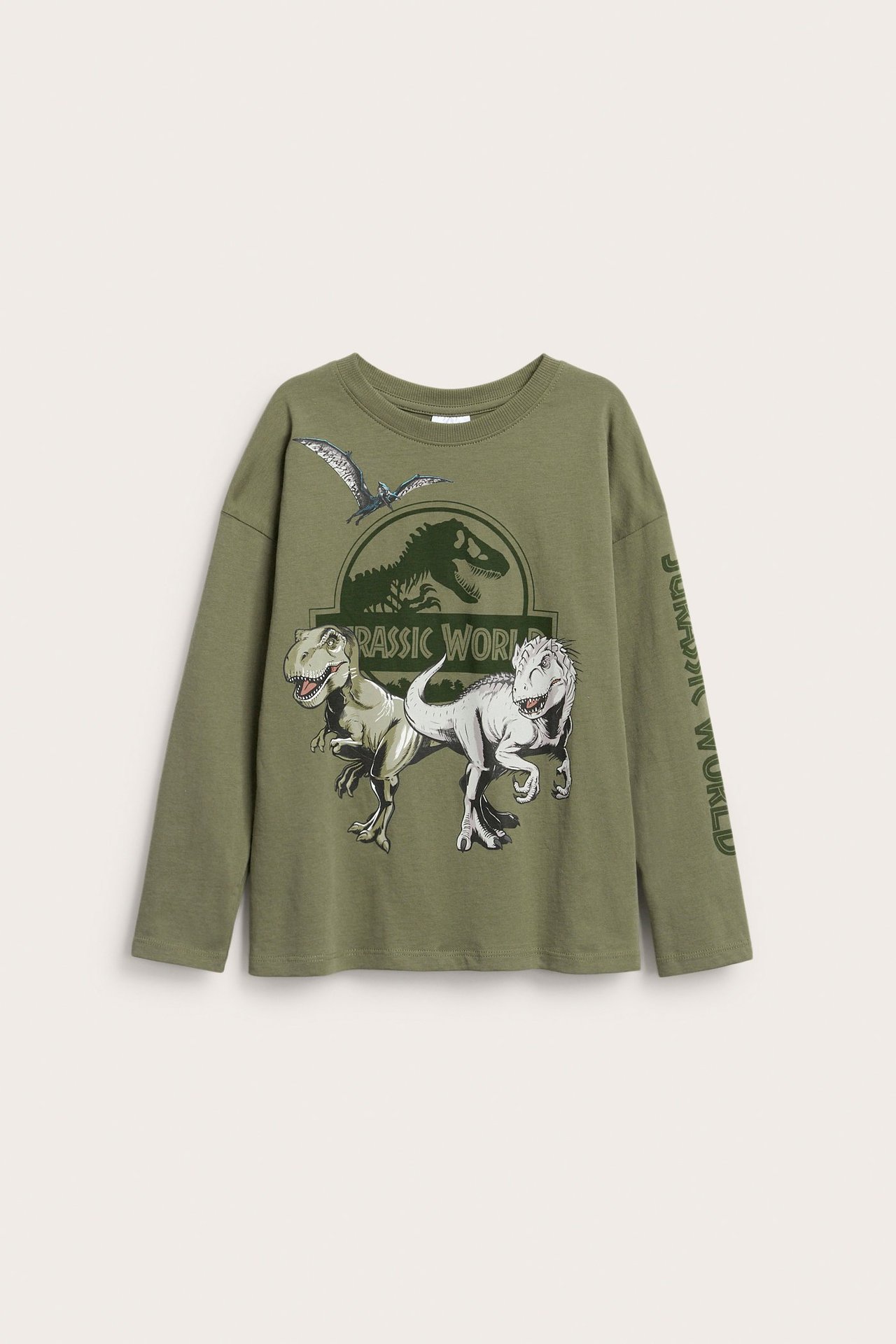 Framsida av en mörkgrön långärmad bomulls-t-shirt för barn med Jurassic Park-dinosauretryck framtill.
