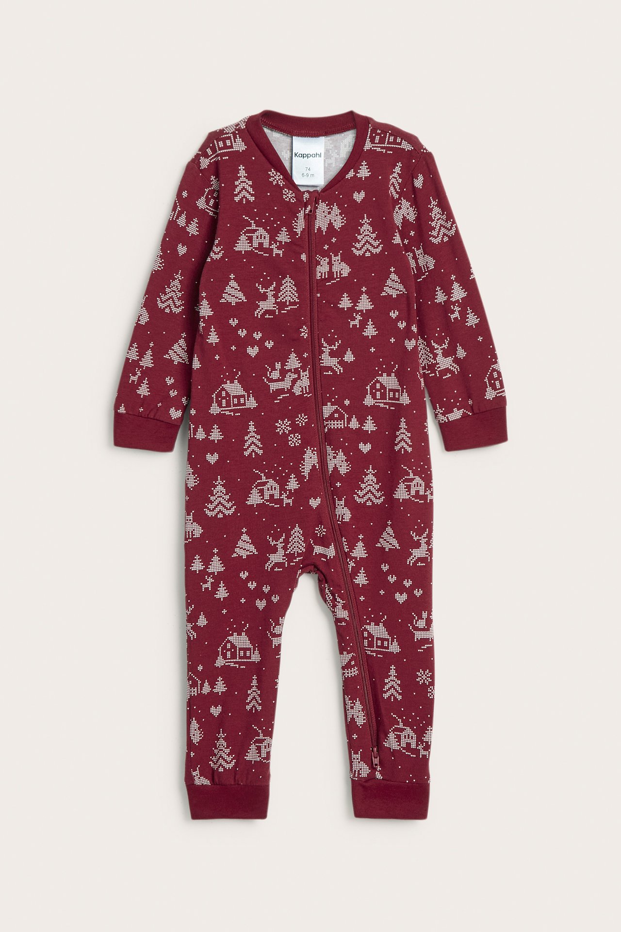 Frontbilde av mørkerød babyromper med hvitt festlig trykk og toveis glidelås.
