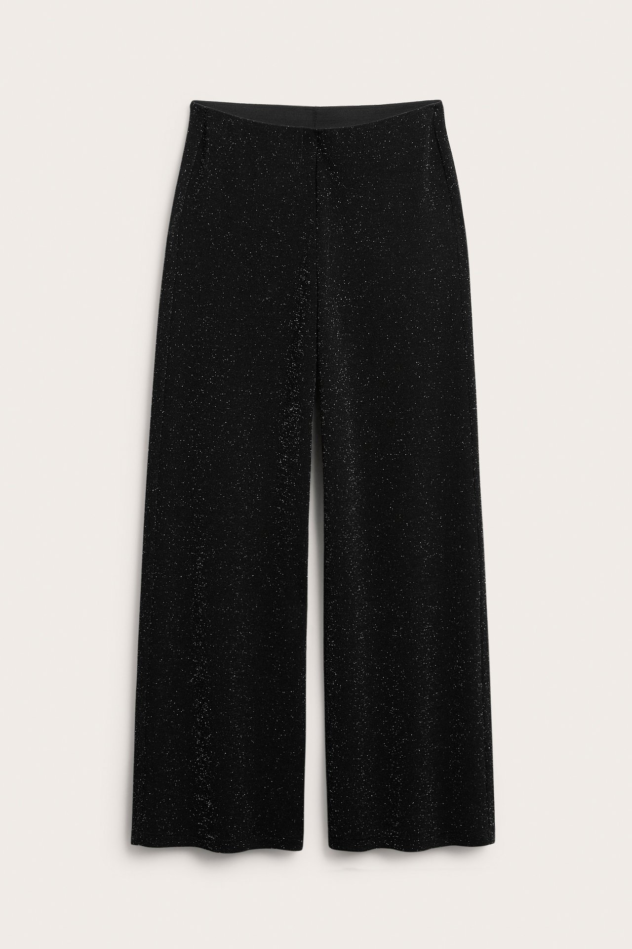 Musta glitterjerseypant vuorokaudella ja leveillä reisillä.