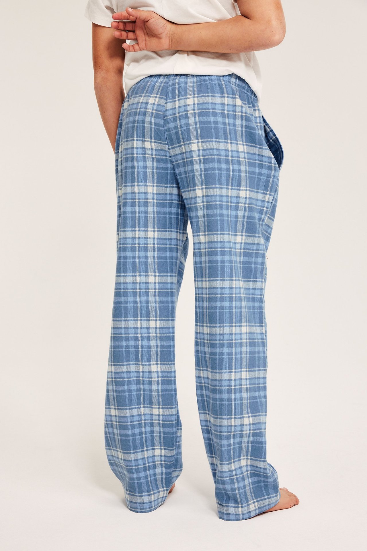 Sininen raidallinen flanellipuserohousut lapselle, elastinen vyötärö, taskut, suora helma.