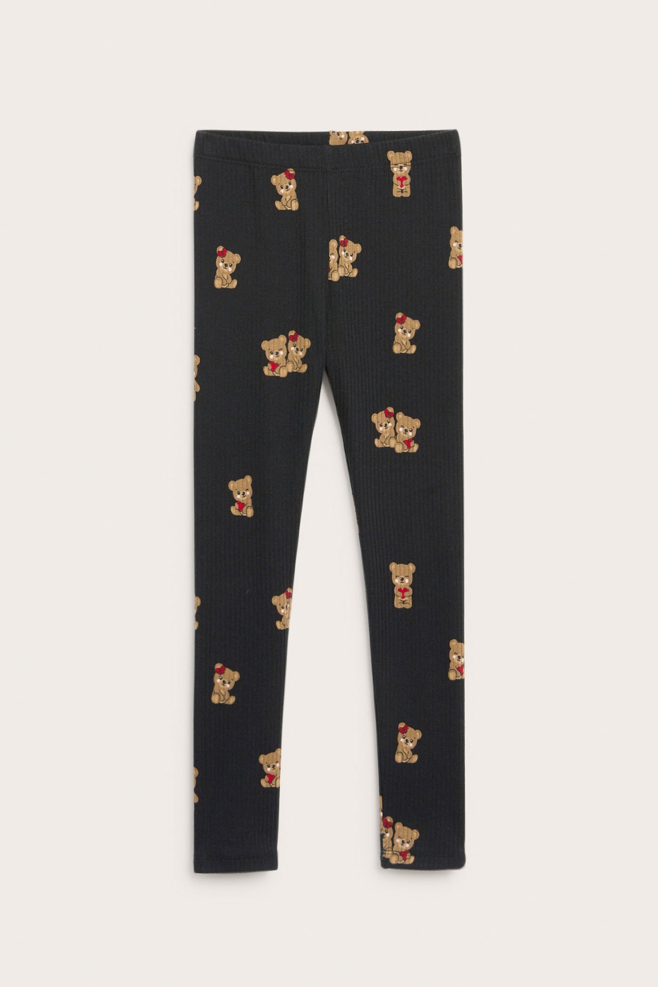 Widok z przodu czarnych, prążkowanych legginsów dziecięcych z misiami.