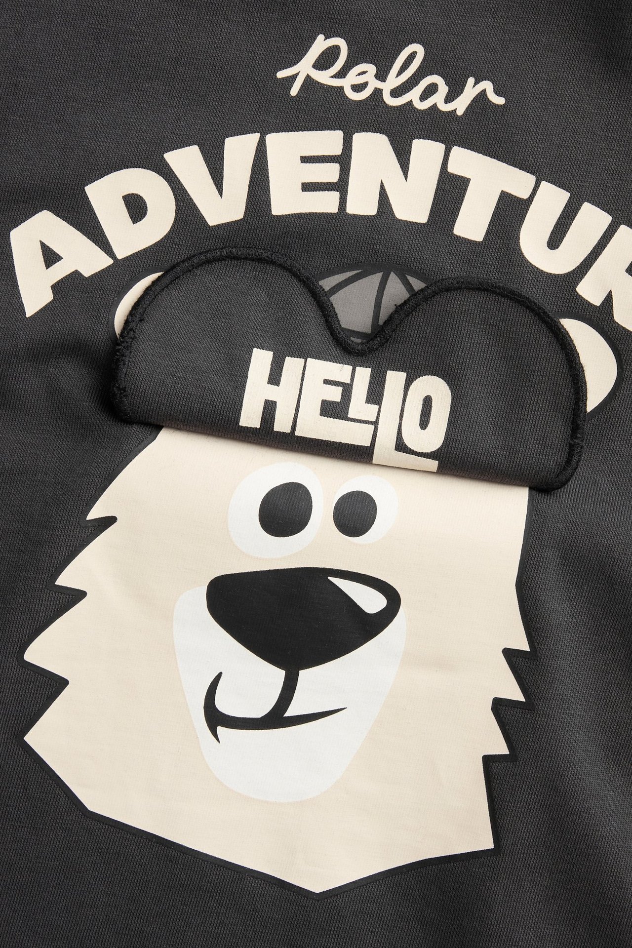 Dziecięca czarna koszulka z długim rękawem; miś polarny z podnoszonymi okularami 'HELLO'.