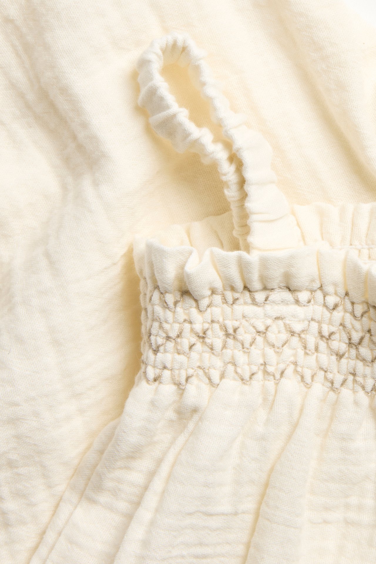 Babyjumpsuit med volanger