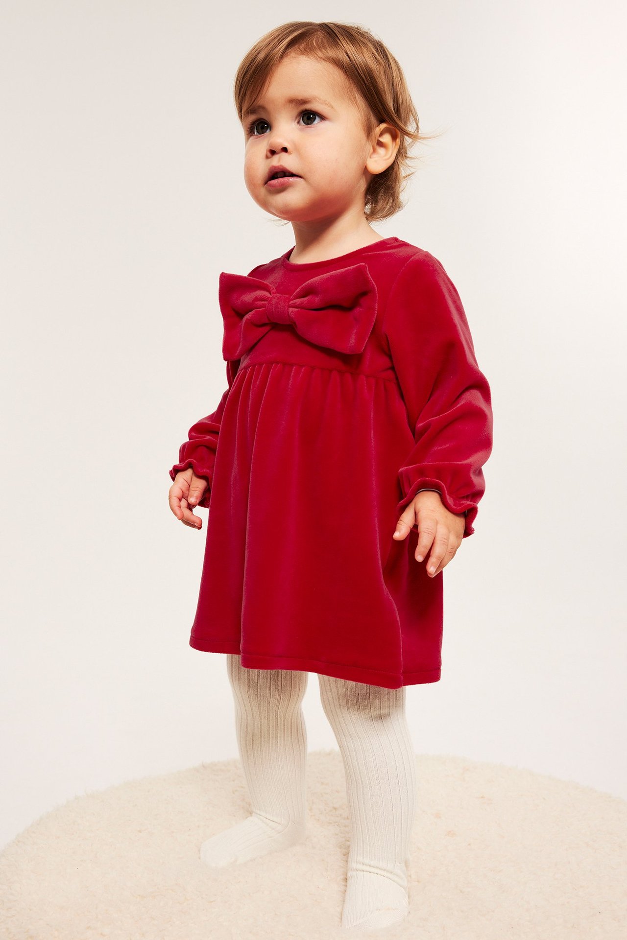 Rød velourkjole for barn med sløyfe foran og knepping bak, liten jente modell.