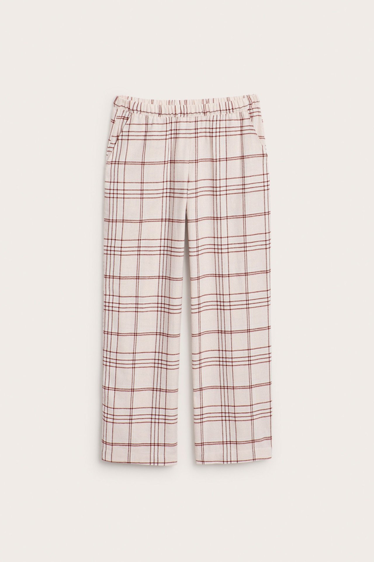 Forfra, lysrosa flanell pyjamasbukser med rødt rutemønster, elastisk midje og sidelommer.
