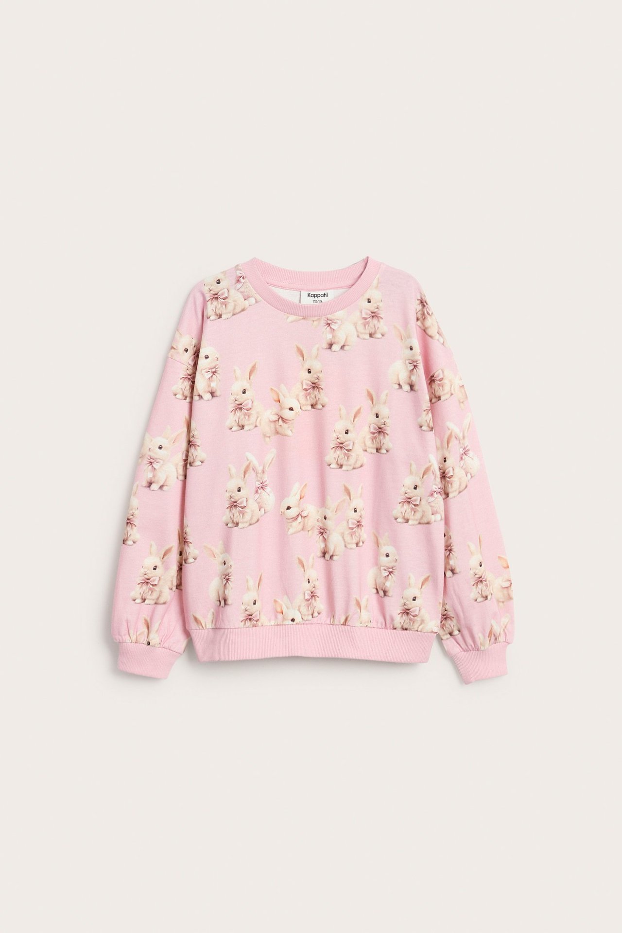 Långärmad ljusrosa topp för barn med kaninmönster, ribb vid hals, ärmar och nederkant.