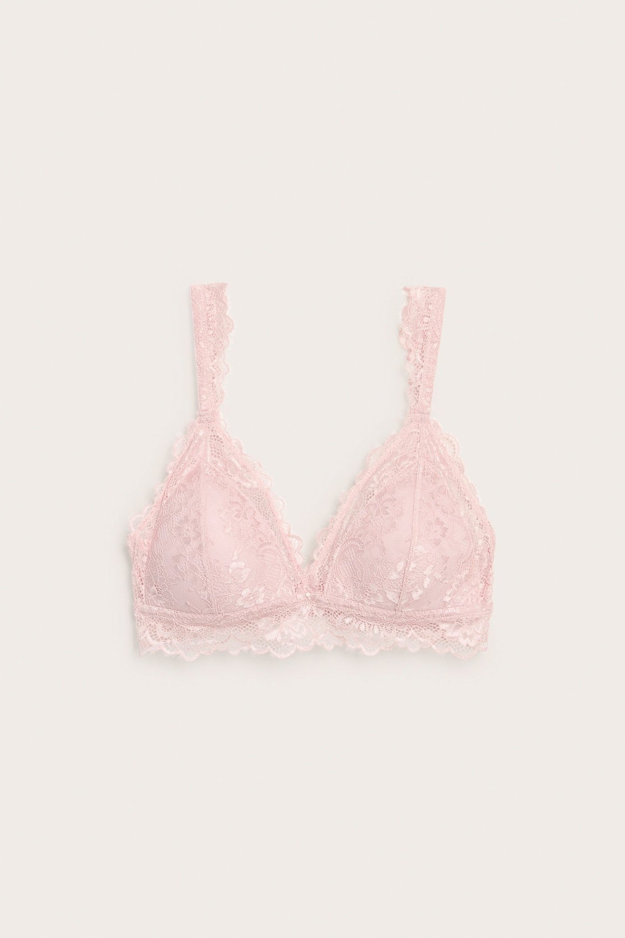 Frontvisning av en lyserosa blondebralette med vatterte, bøylefrie kopper og justerbare stropper.