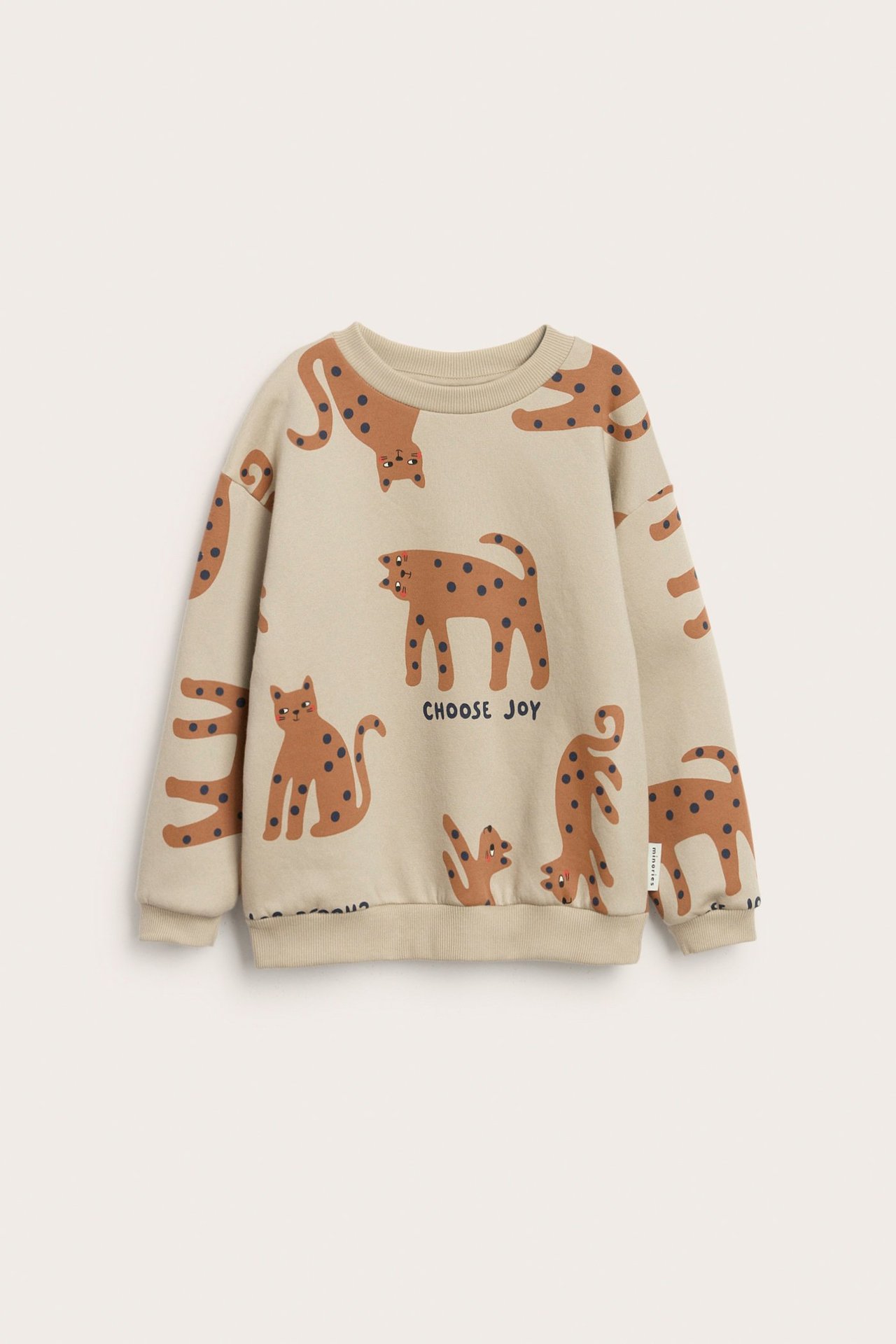 Beige kuviollinen collegepaita leijona- ja tiikerikuvioilla, rib Heijastin kauluksessa, hihoissa ja alaosassa.