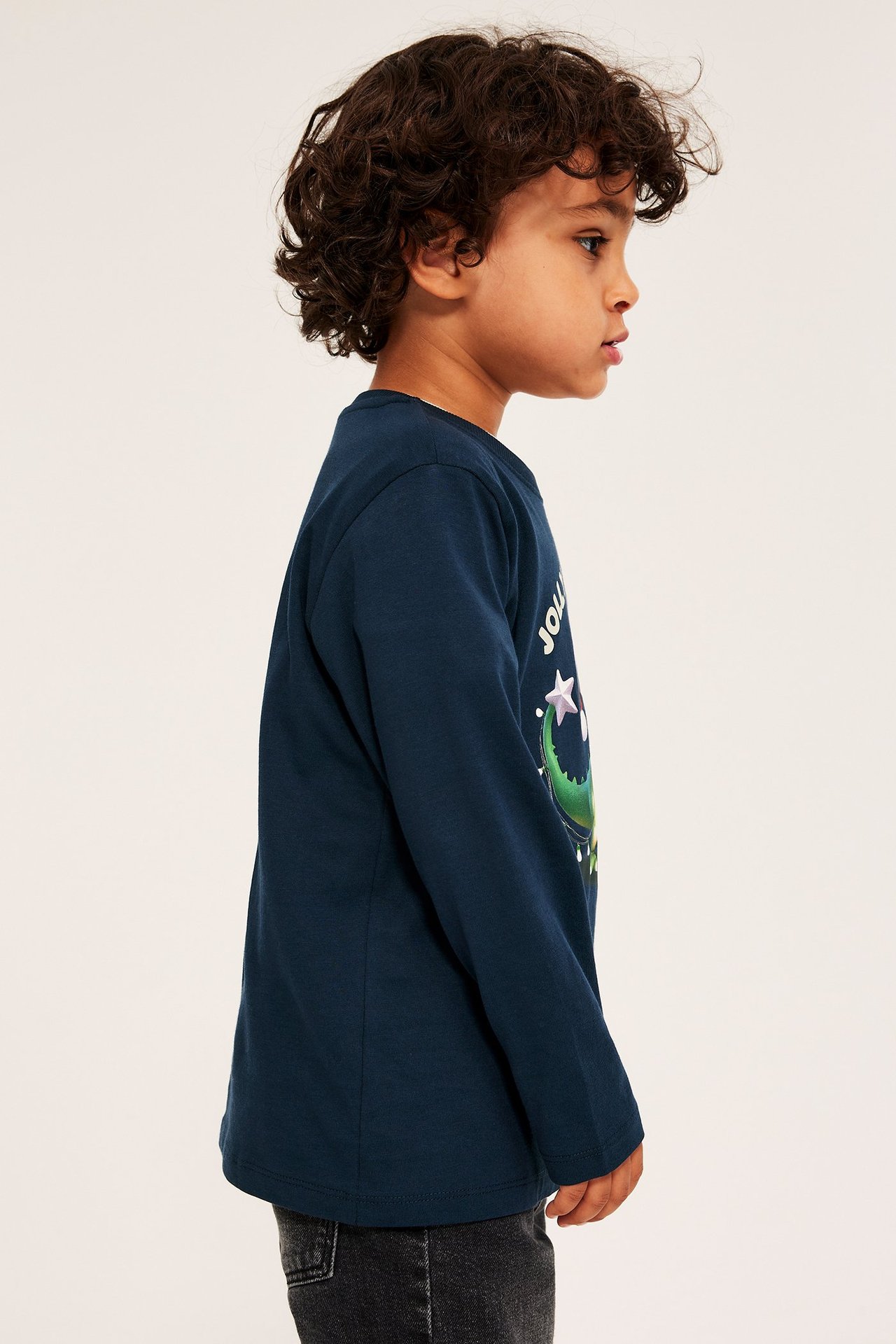 Mørk blå langermet T-skjorte med juledinosaurus og ribb i halsen.