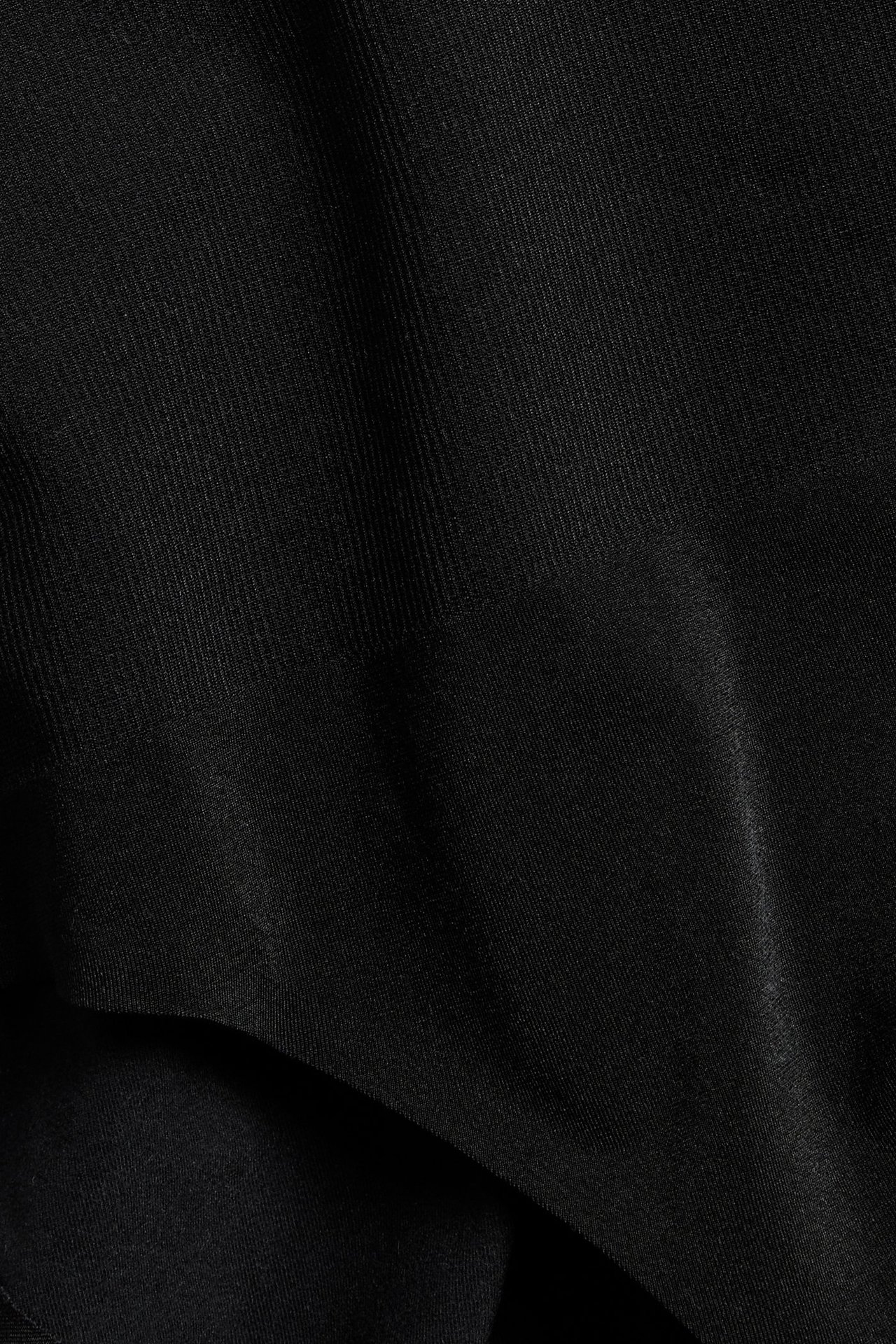 Närbild på svart sömlöst tyg till en sömlös trosa.