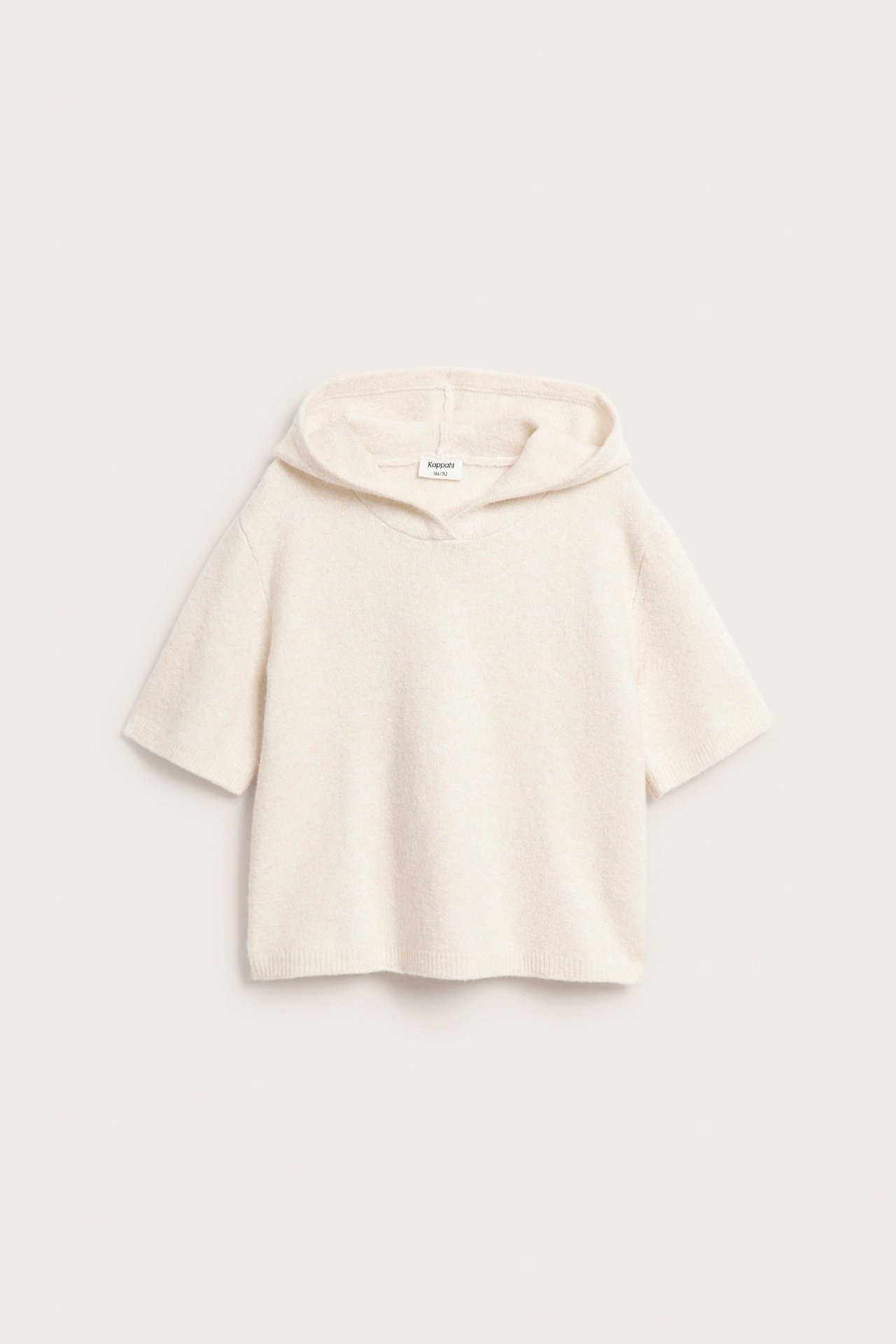 Widok z przodu: biały, krótki sweter z kapturem.