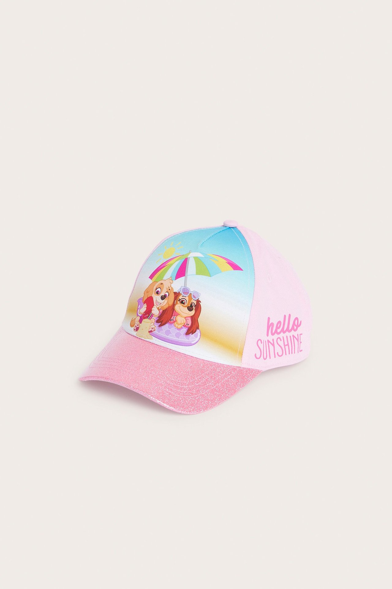 Vaaleanpunainen lasten lippalakki, jossa kimaltava pinkki lippa ja värikäs Ryhmä Hau -printti edessä, etuviisto näkymä.