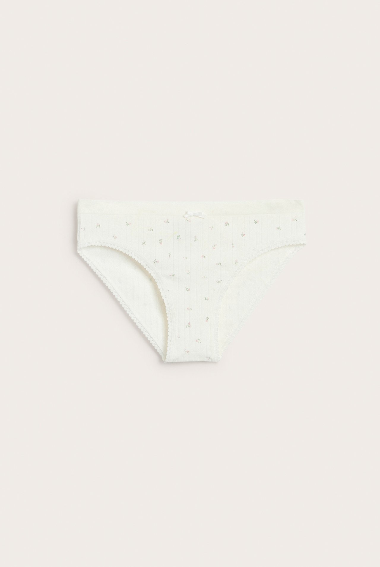 Vit seamless brief i pointelle med mönster och regular midja, för kvinnor, frontvy.