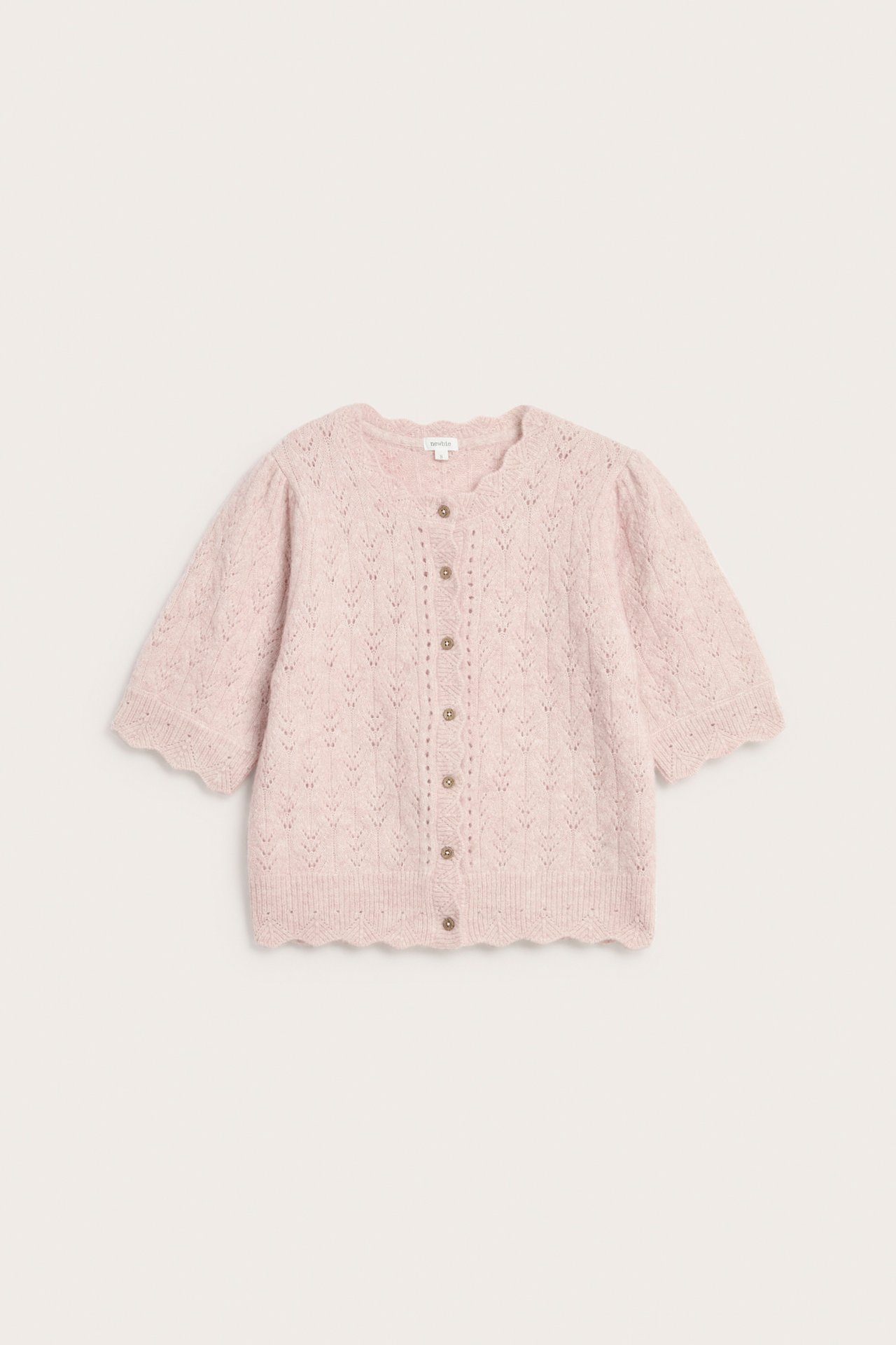 Edestä kuvattuna, naisten vaaleanpunainen neulottu villasekoitekardigaani kuviollisella muotoilulla ja aaltoilevilla reunoilla.
