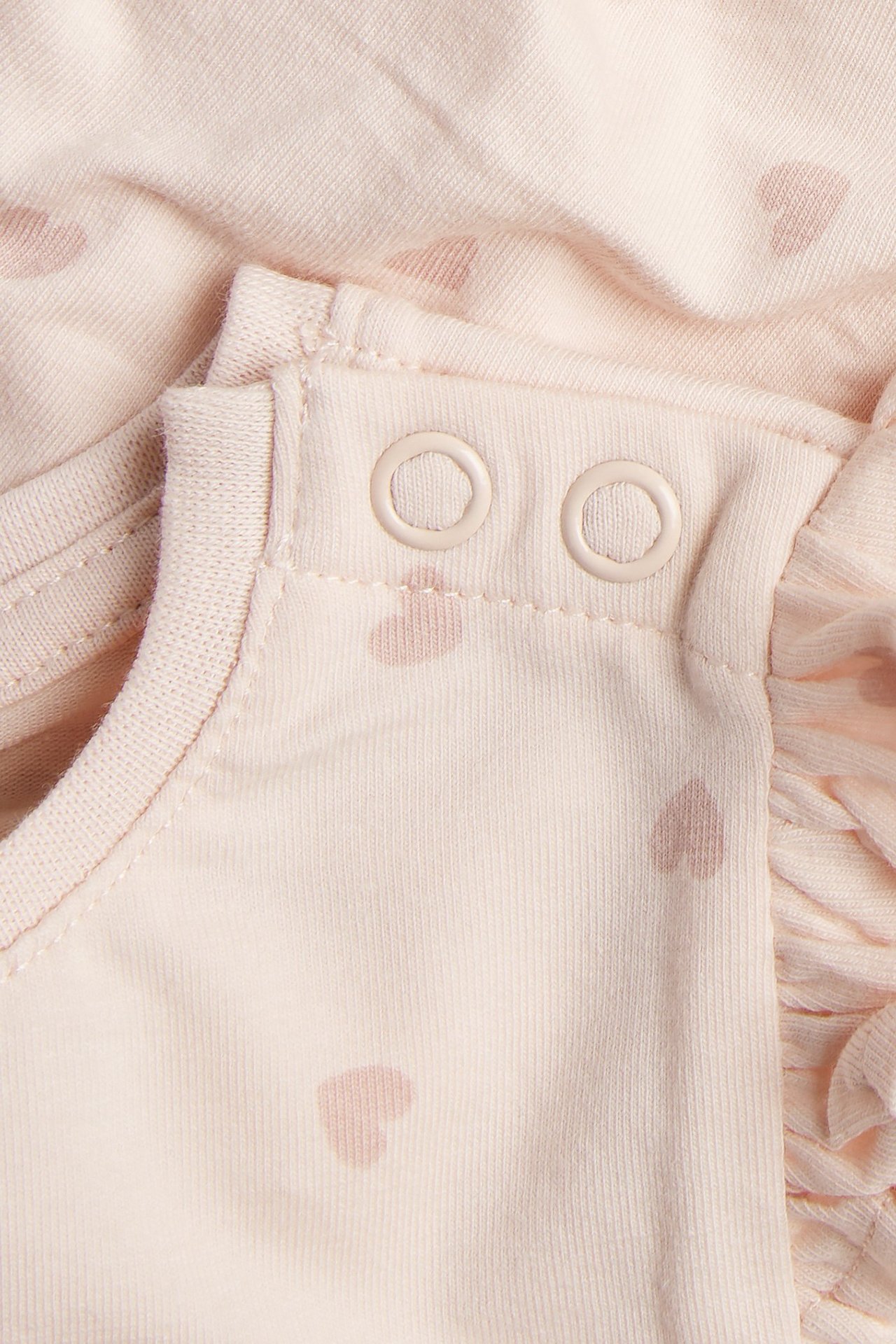 Långärmad body med hjärtan