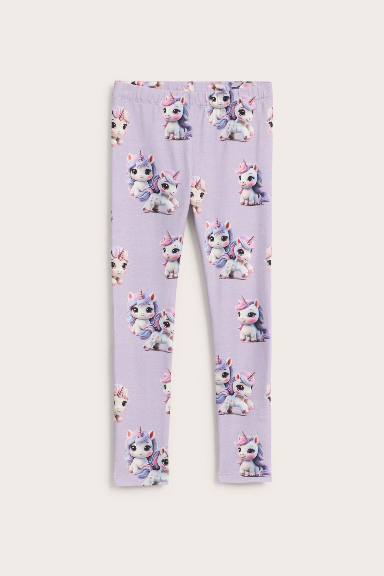 Edestä näkymä lasten vaaleanliiloista puuvillasekoiteleggingseistä, joissa on yksisarviskuvio.