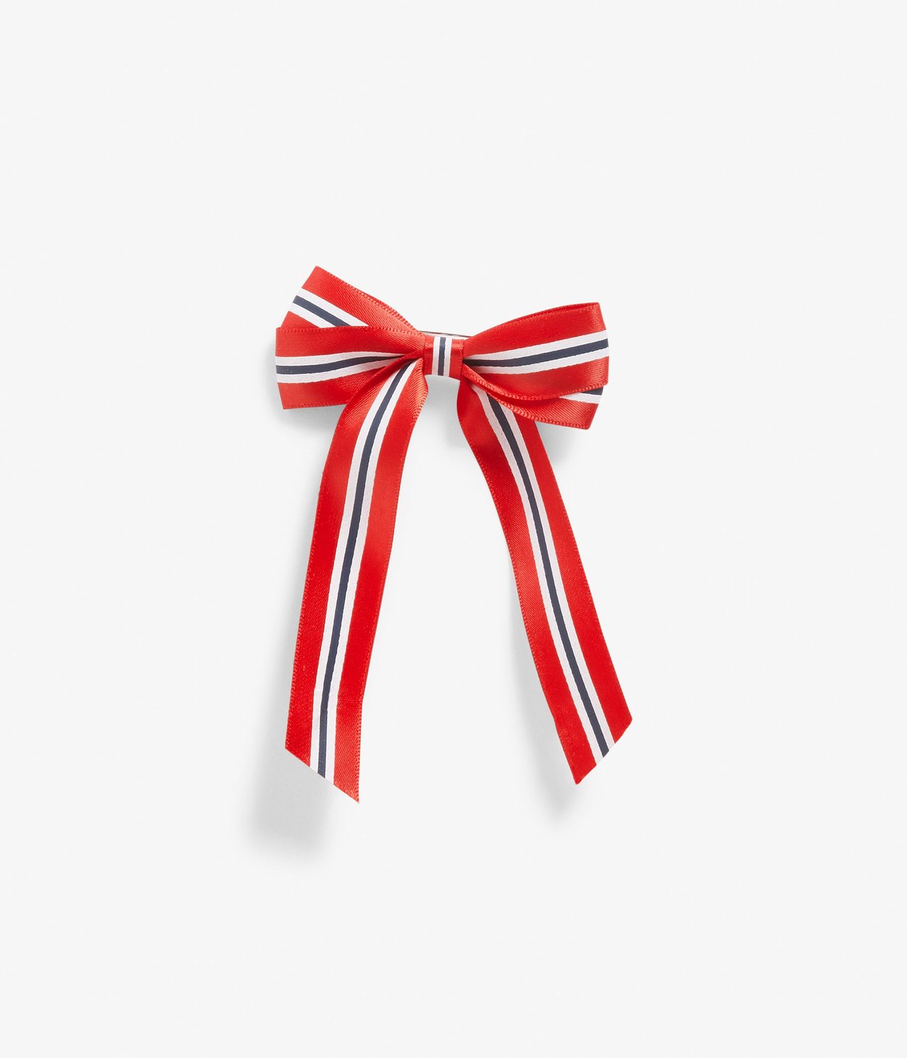 Ovenfra sett rød polyester sløyfebrosje med blå og hvite striper, som ligner det norske flagget.