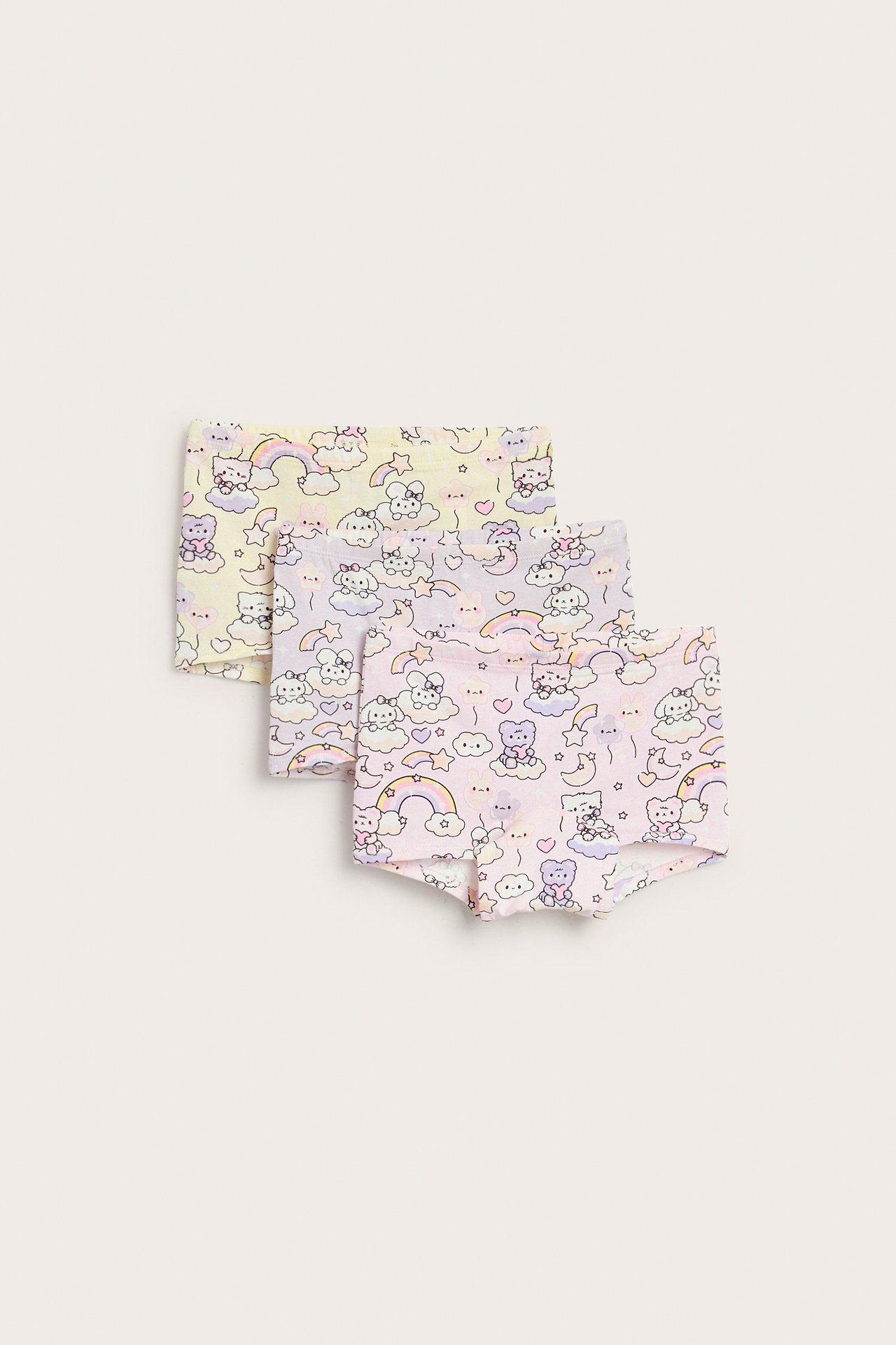 Widok z przodu: Trójpak dziecięcych bokserek we wzory, jasnoróżowych, liliowych i żółtych, z postaciami.