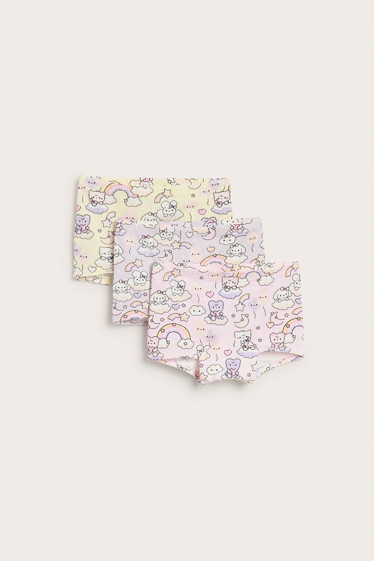 Widok z przodu: Trójpak dziecięcych bokserek we wzory, jasnoróżowych, liliowych i żółtych, z postaciami.