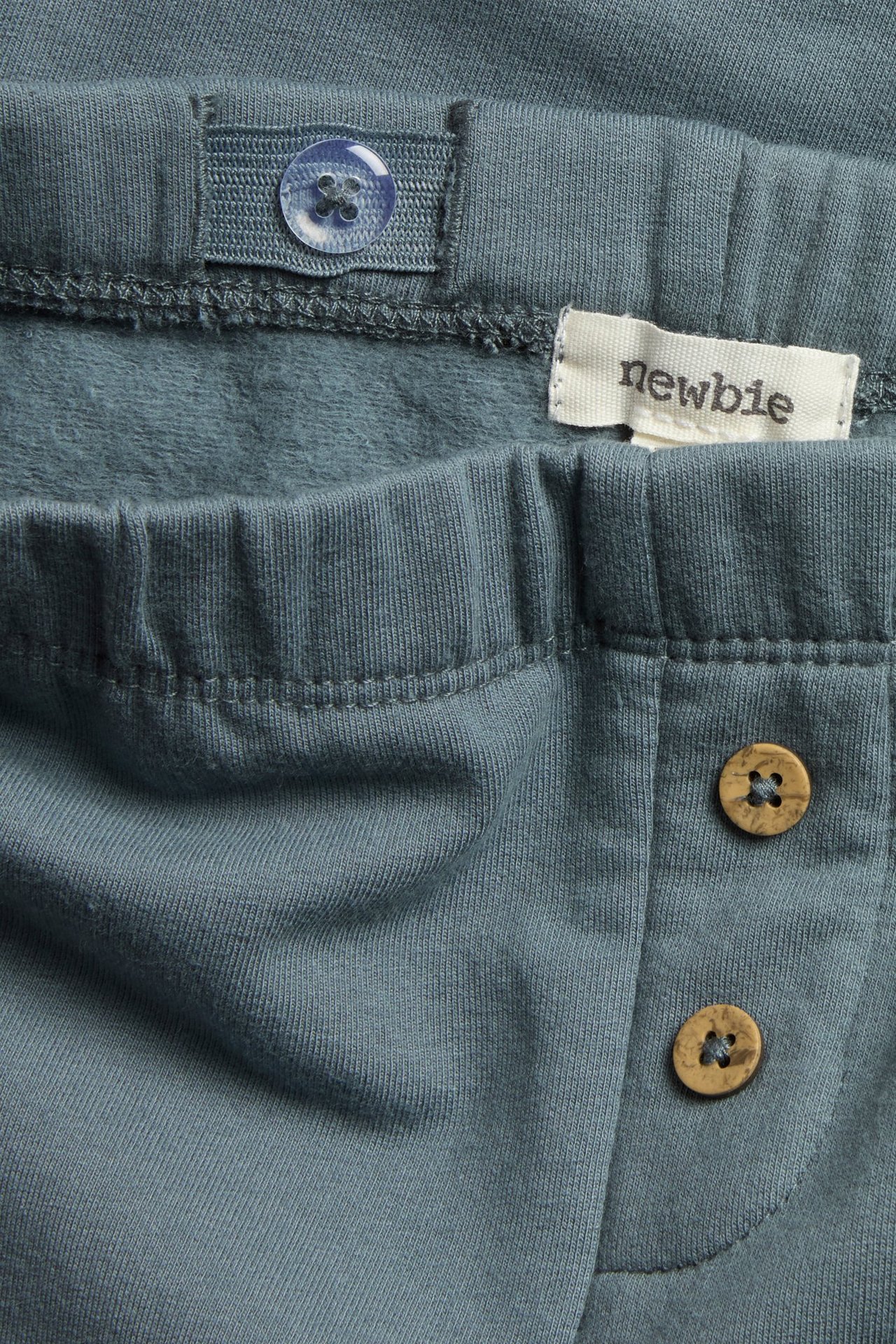 Siniset fleecelegginsit lapsille, polkkapplikaatio, säädettävä vyötärö ja edessä napit.