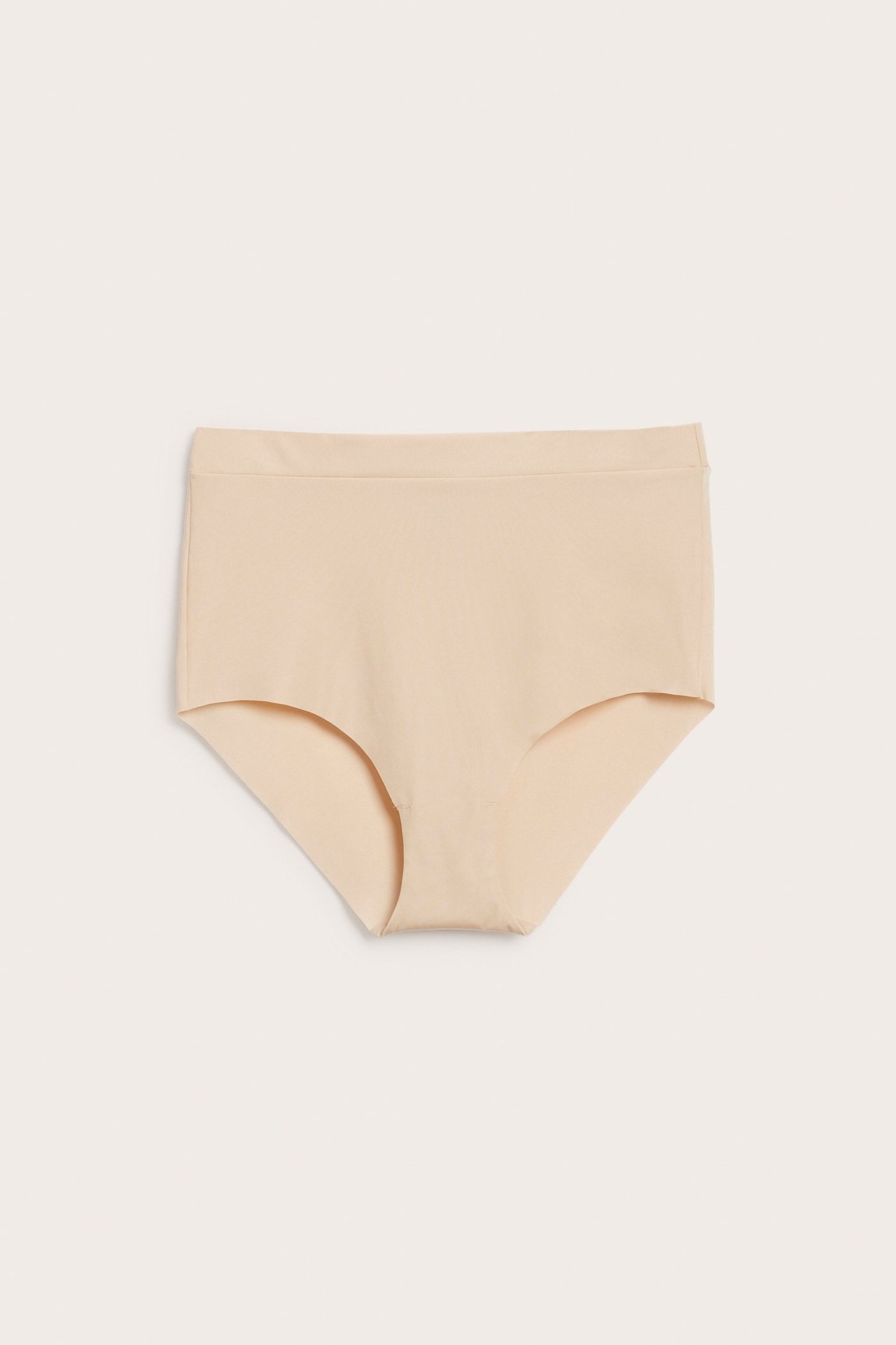 Framifrån, ljusrosa sömlös micro hipstertrosa med resårlinning och rena benslut.