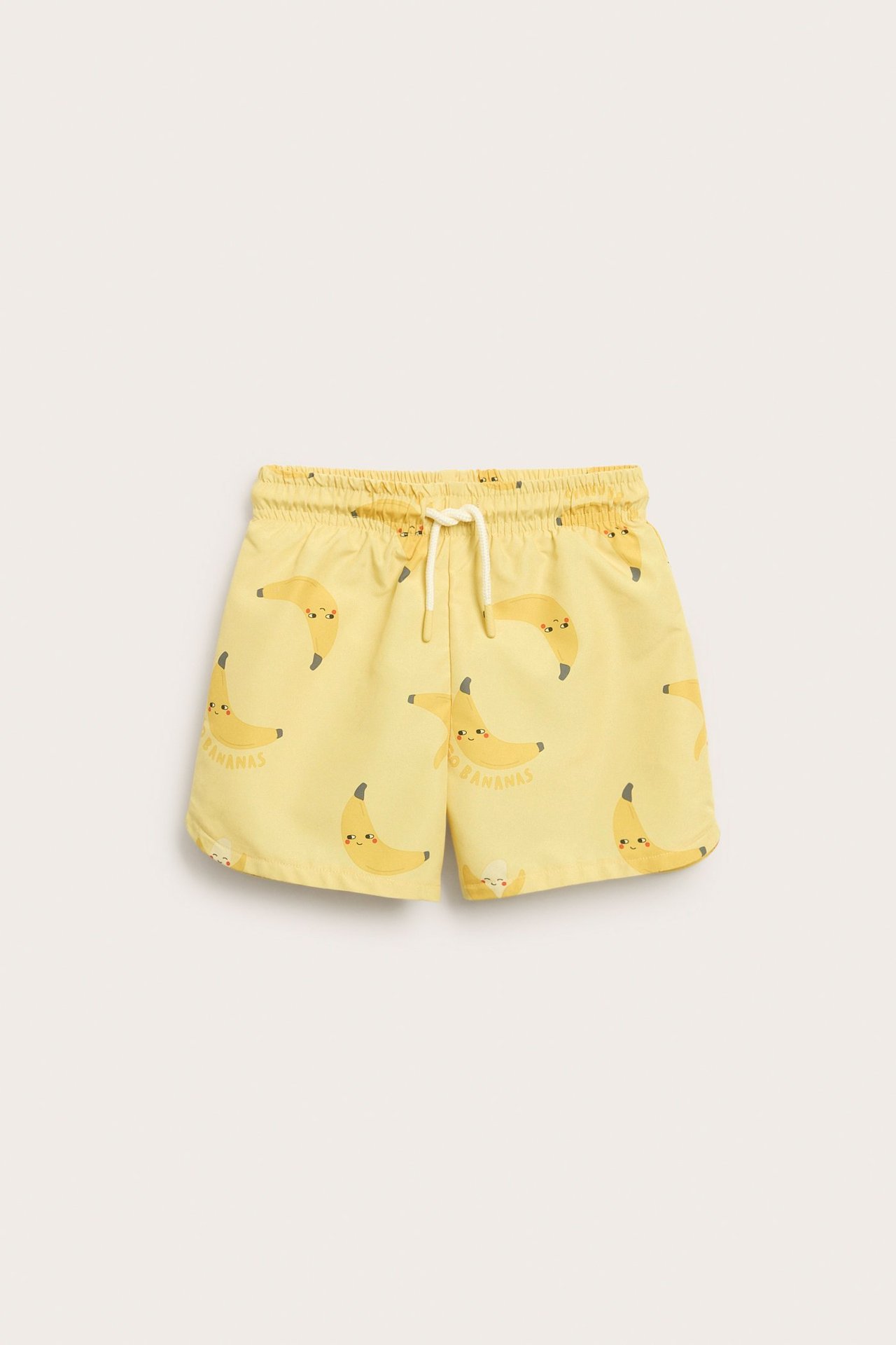 Lasten keltaiset uimashortsit edestä: kudotut, joustava vyötärö, kiristysnyöri, banaanikuvio.