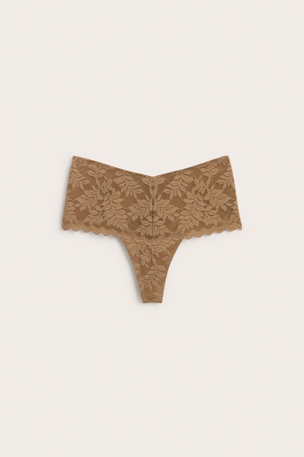 Forfra, brun blonde stringtruse med høy V-formet midje og bølgede kanter.