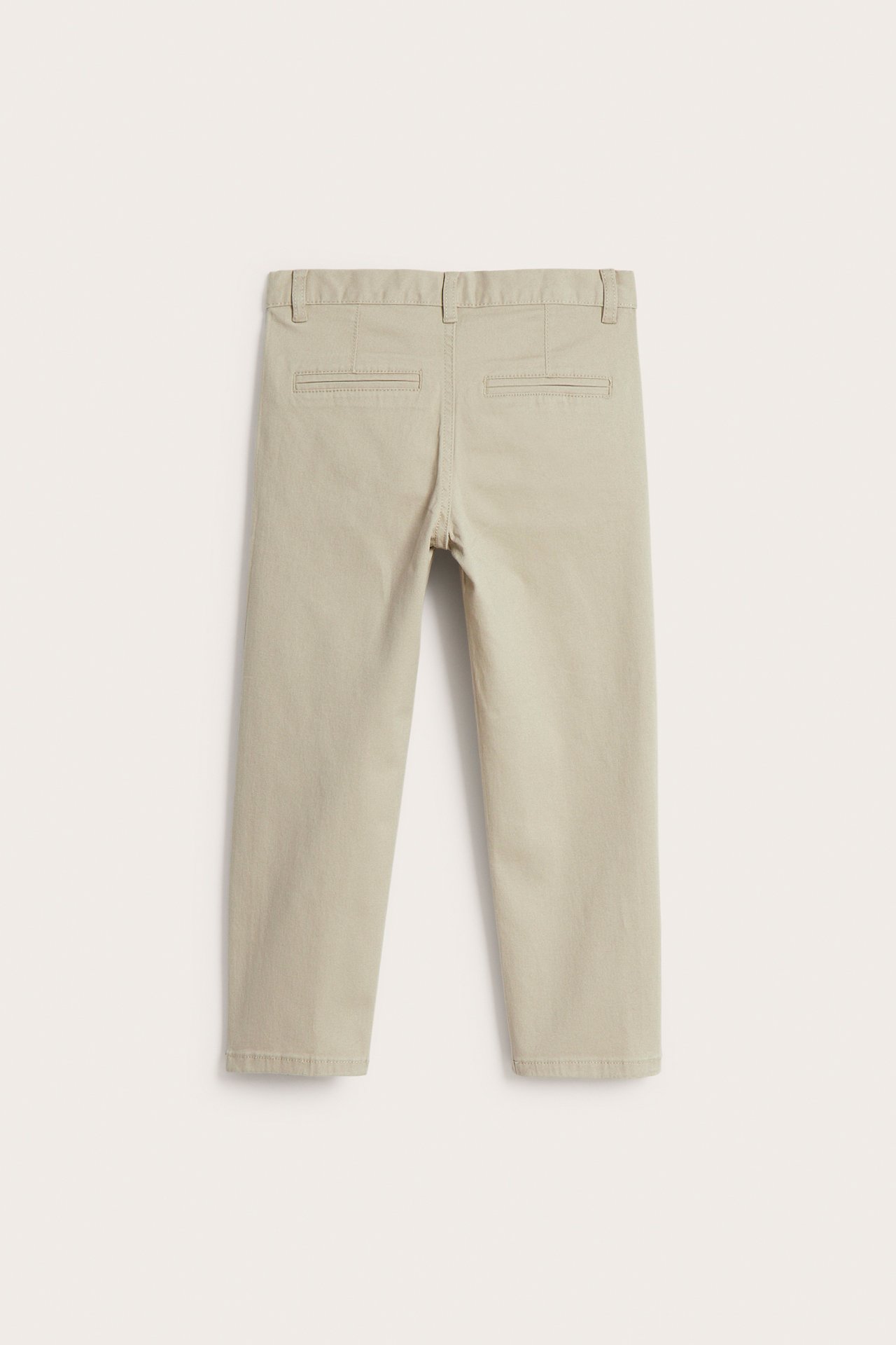 Lasten beiget puuvillatwillichinot takaa, takataskut.