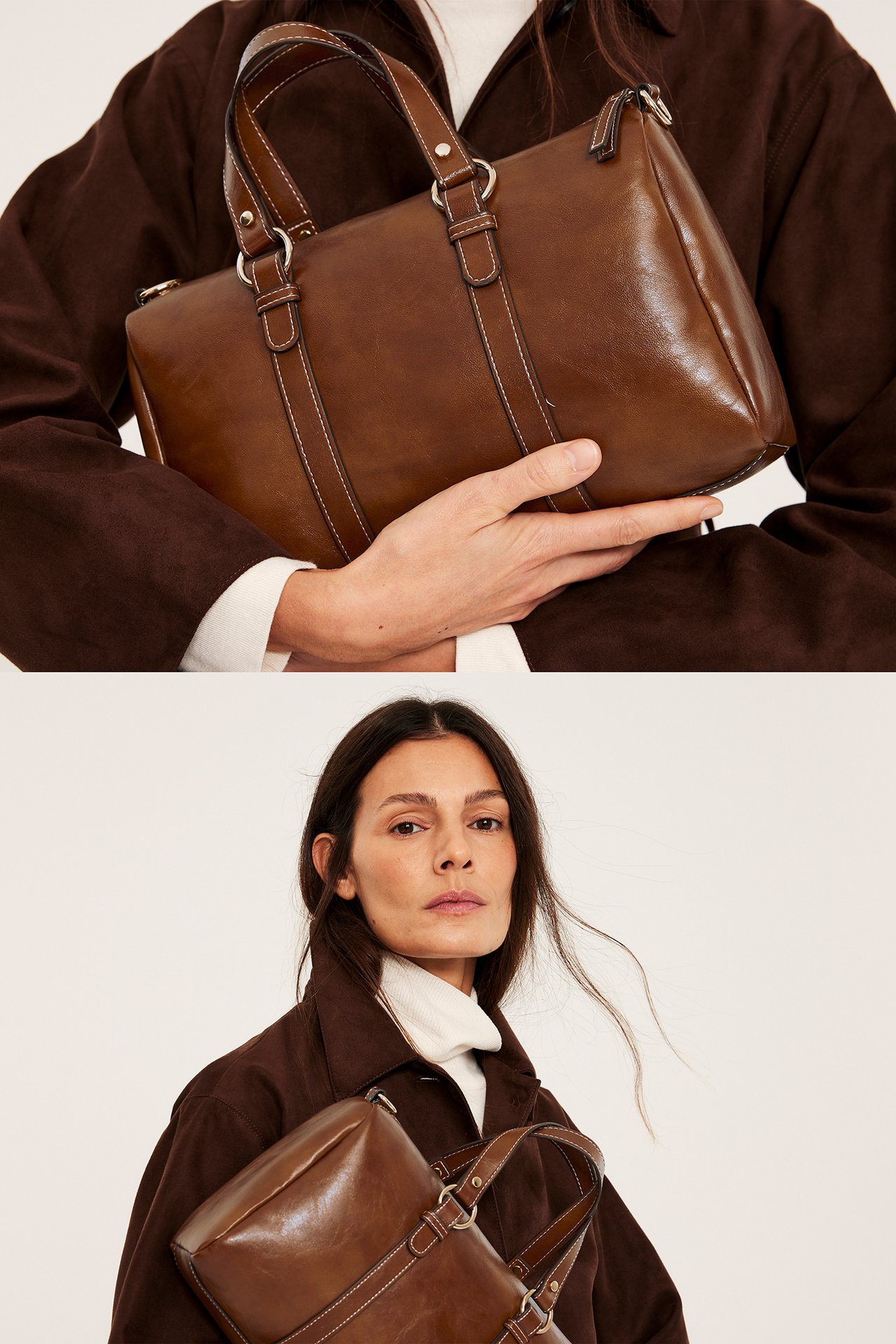 Edestä: Ruskea suorakaiteinen käsilaukku valkoisilla ompeleilla, nainen pitelee sitä, ruskea takki ja valkoinen poolopaita.