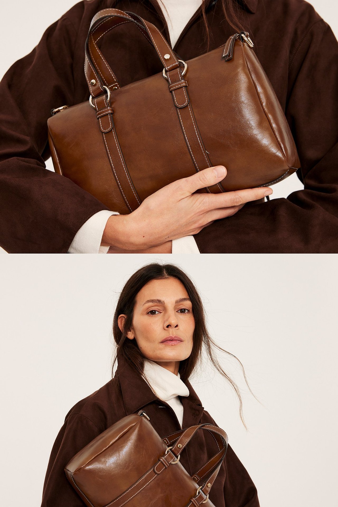 Frontbilde: Brun rektangulær håndveske med hvite sømmer, holdt av kvinne i brun kåpe og hvit pologenser.