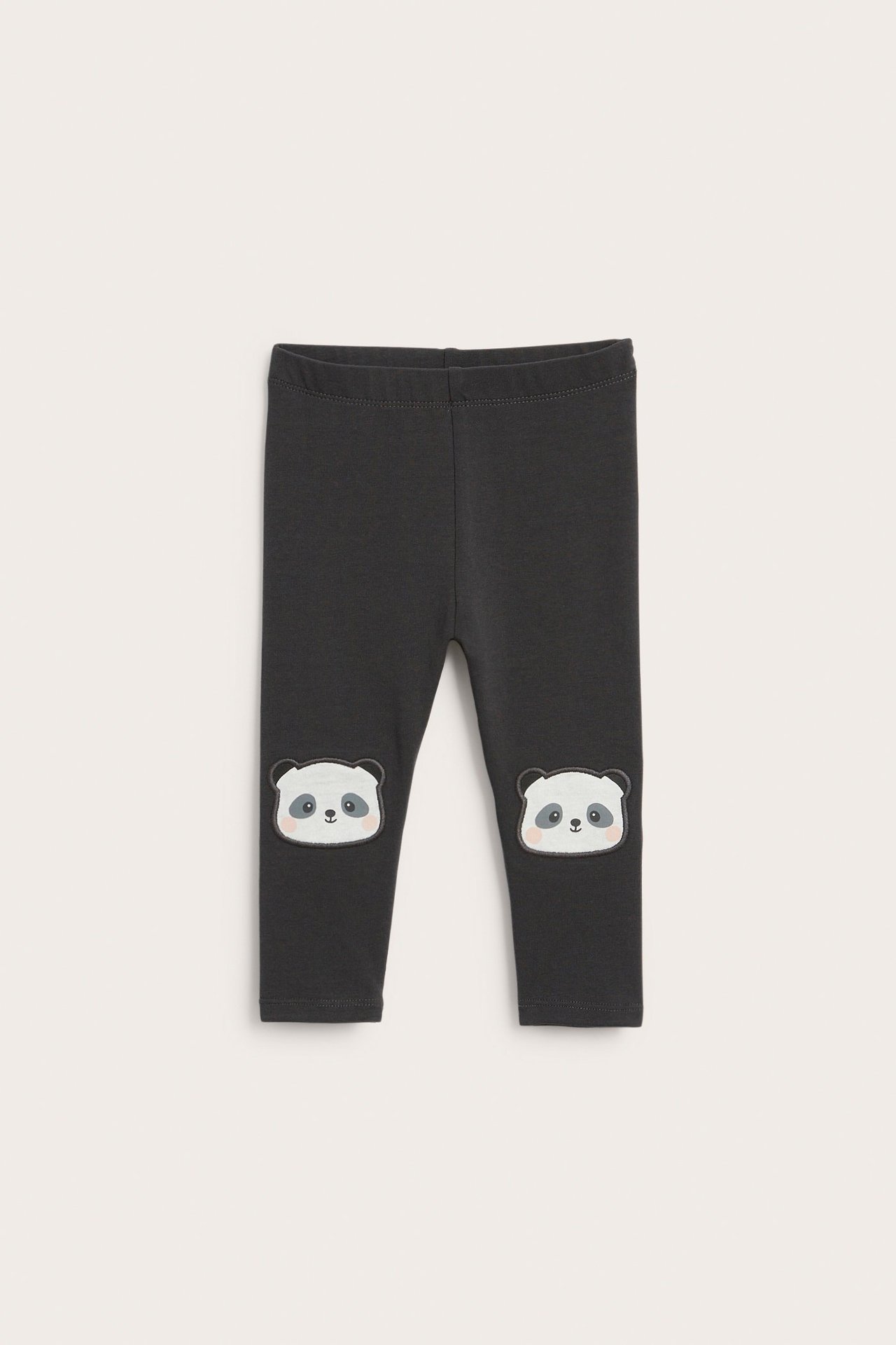 Frontutsikt: Mørkegrå baby-leggings med hvite panda-applikasjoner på knærne og elastisk midje.