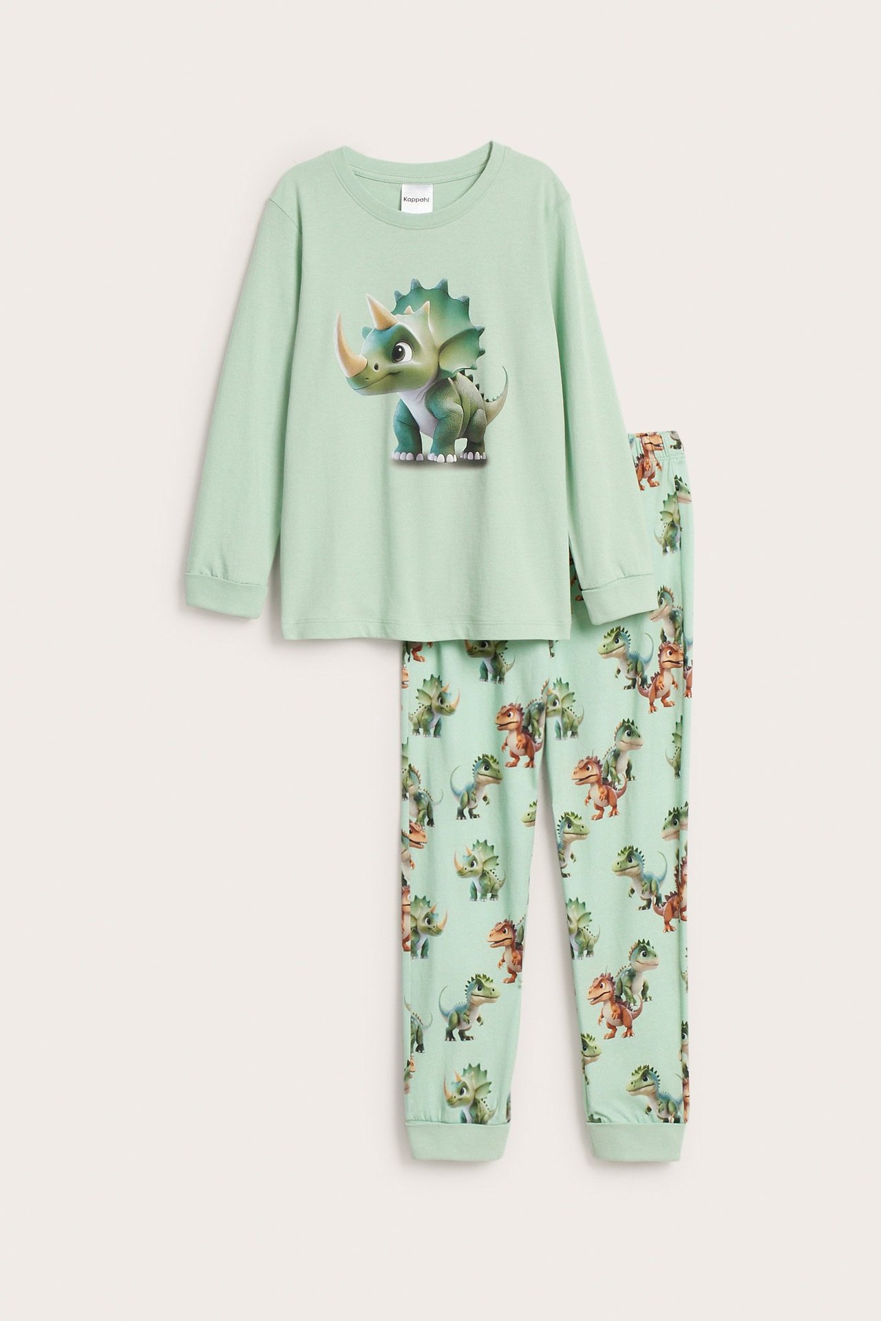 Edestä: Lasten vihreä puuvillapyjama. Paidassa suuri dinosaurusprintti, housuissa kauttaaltaan dinosauruskuvio.