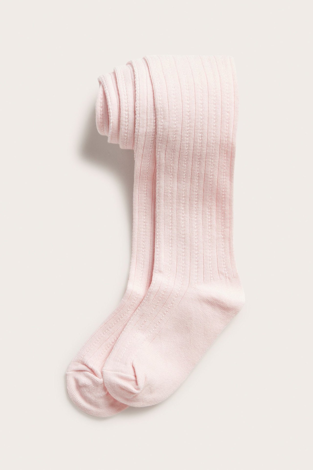 Widok z przodu: Jasnoróżowe rajstopy z bawełny we wzór, złożone.