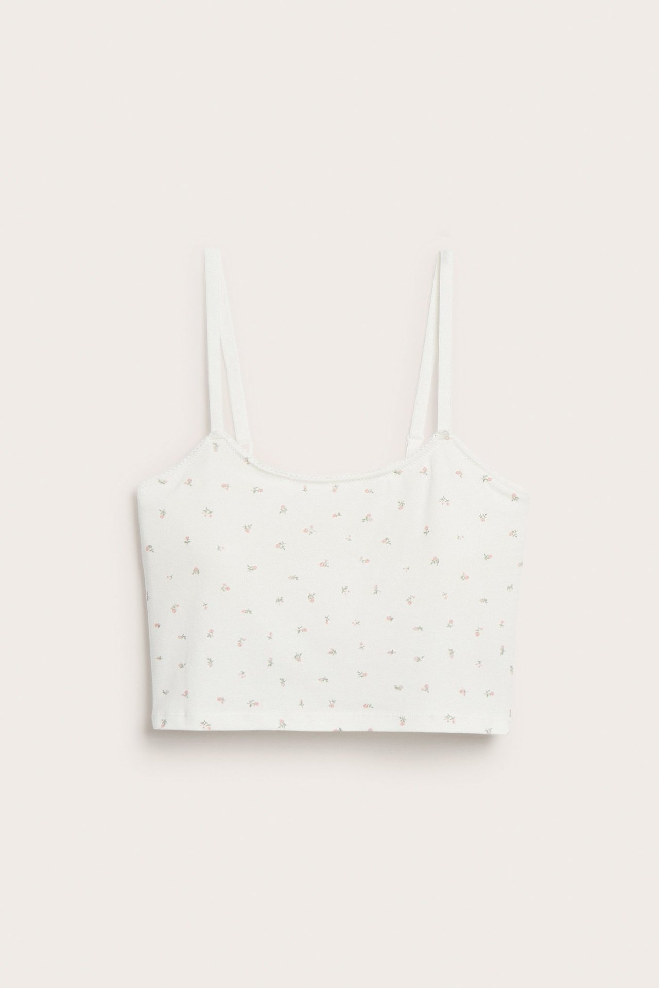 Frontbilde: Off-white bomullsblanding lang bralette med delikat rosa blomstermønster og tynne stropper.