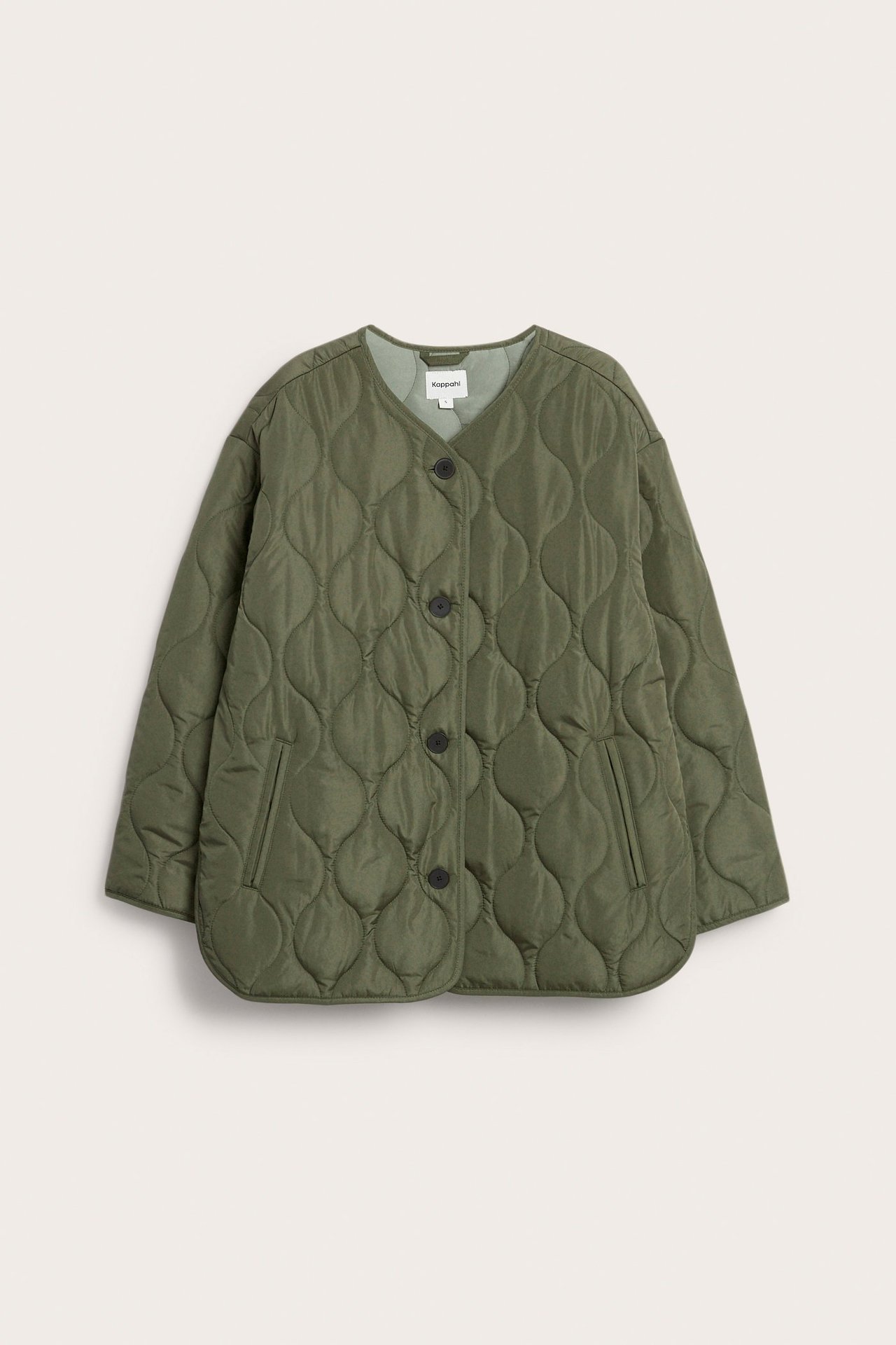 Vihreä tikattu takki V-pääntiellä, nappikiinnityksellä edessä ja kahdella paikkataskulla, etunäkymä.