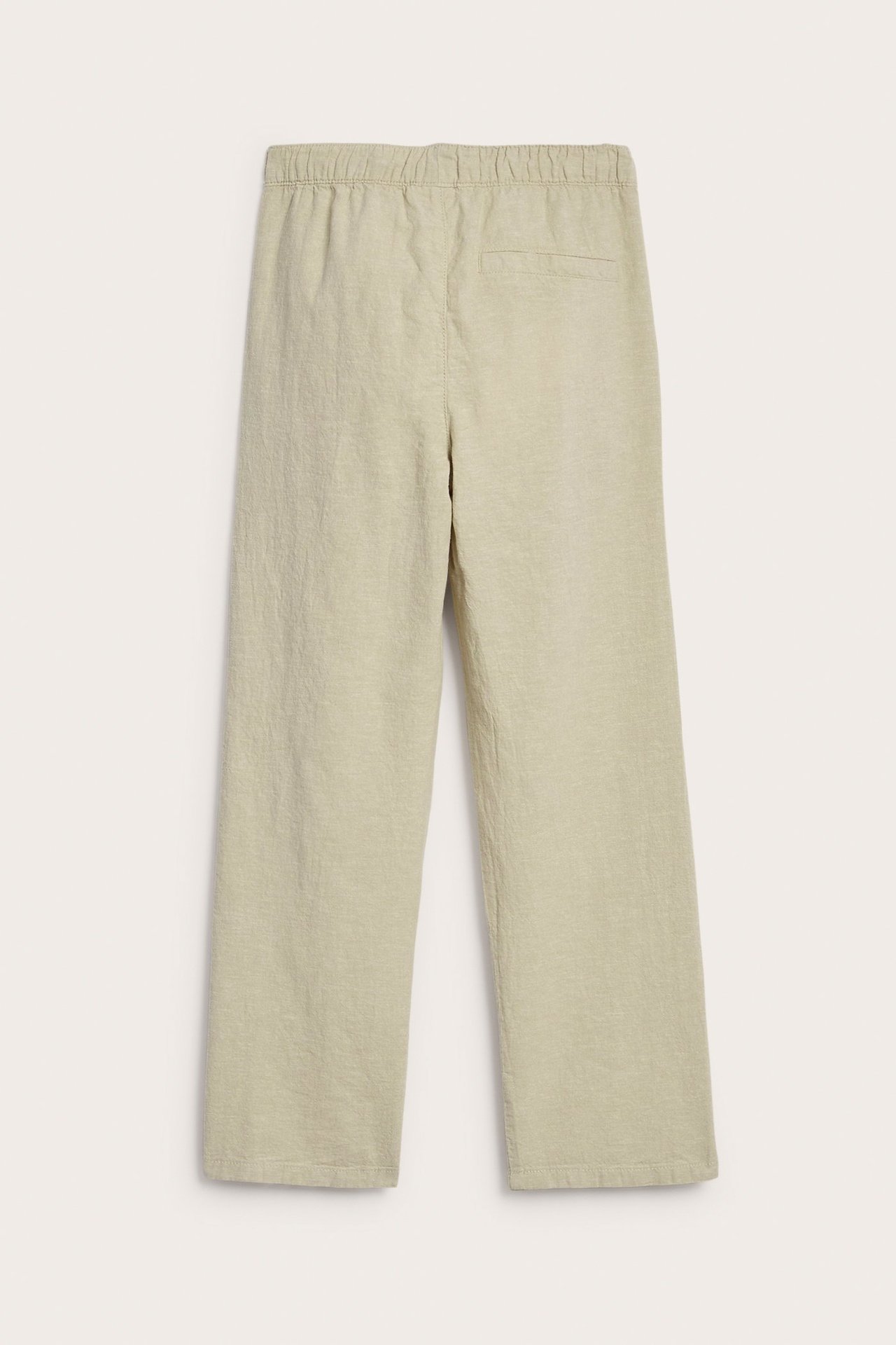 Widok z tyłu beżowych spodni z domieszką lnu, z elastyczną talią i prostymi nogawkami.