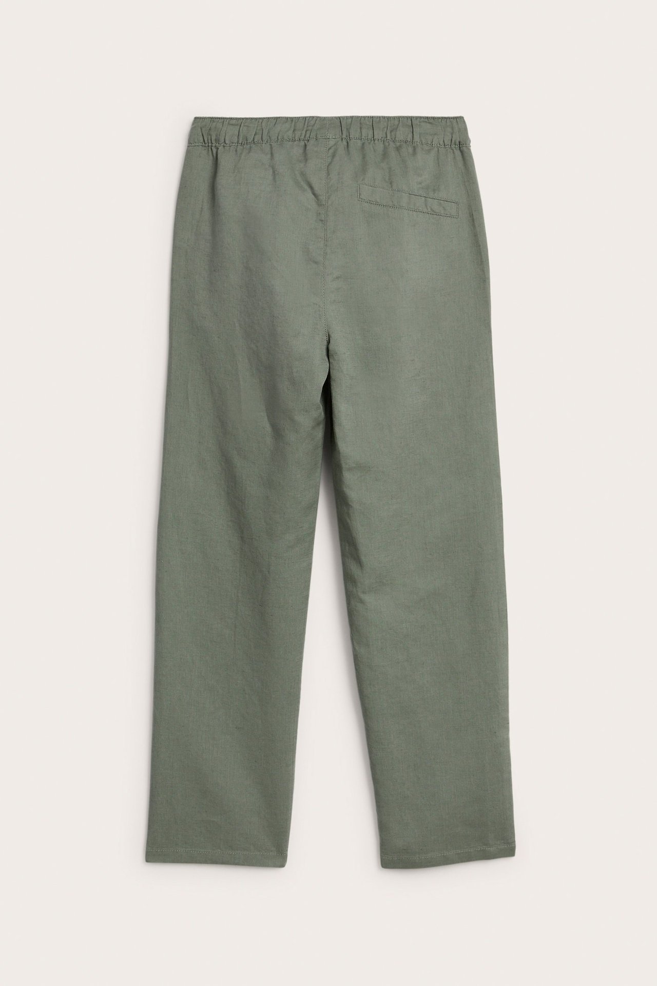 Widok z tyłu zielonych spodni z mieszanki lnu z elastyczną talią i tylną kieszenią.