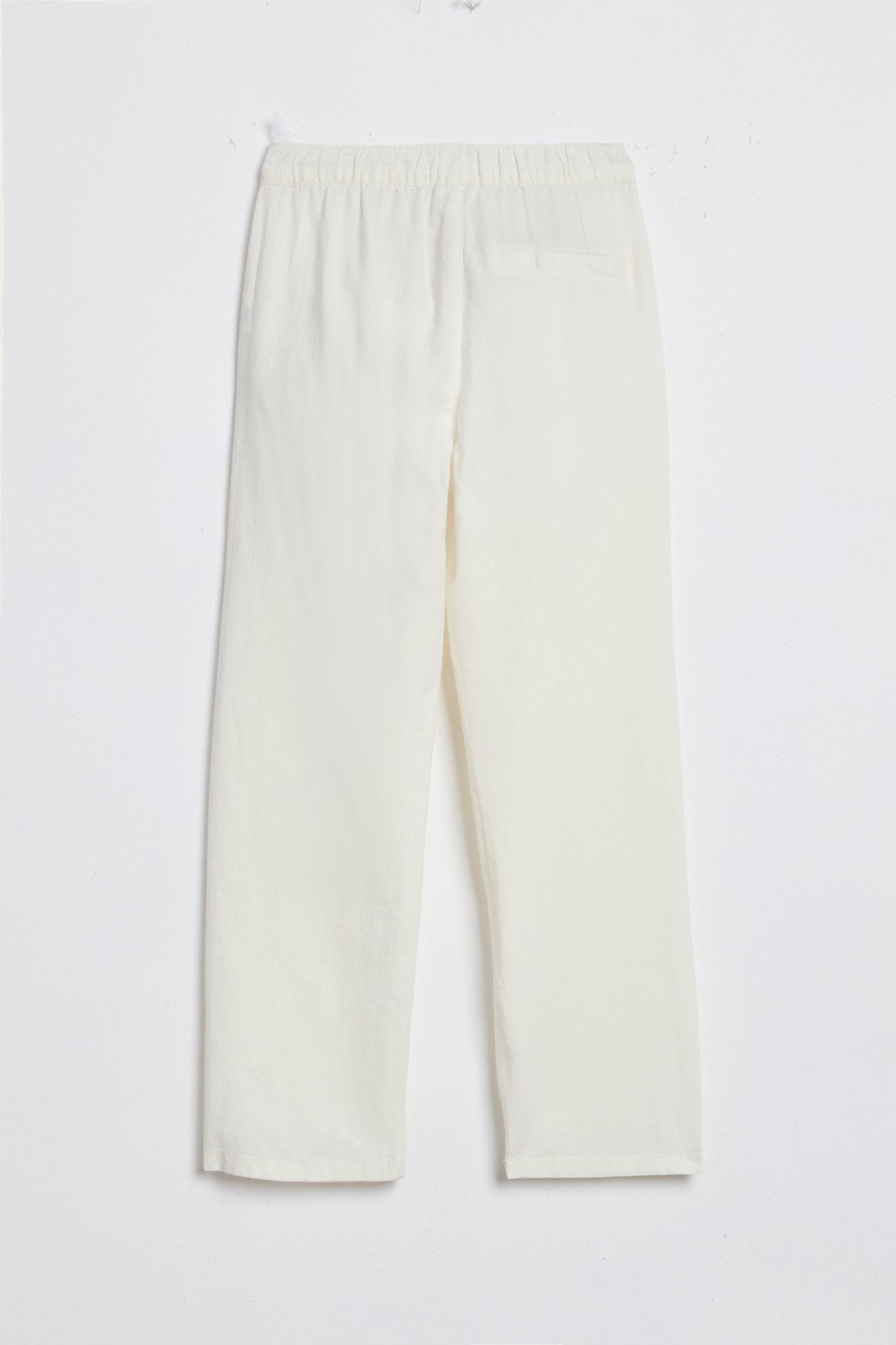 Forfra, offwhite linblanding bukser med elastisk linning og rette ben.