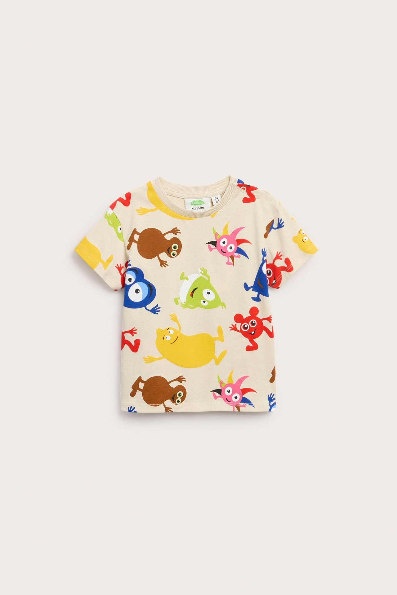 Frontvy av en ljusbeige barnt-shirt i bomull med färgglatt Babblarna-tryck.