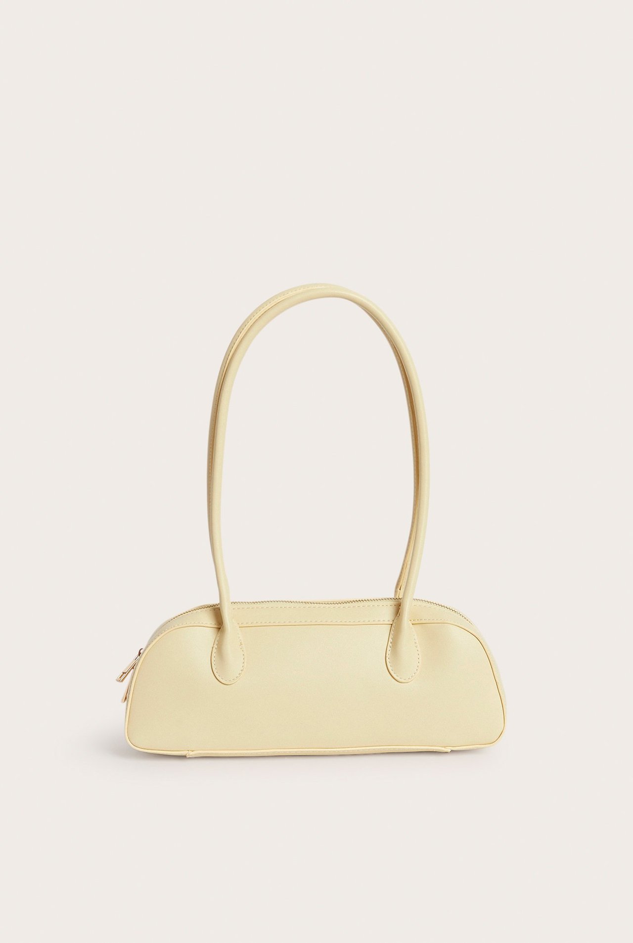 Frontvisning av en ensfarget lys gul bowlingveske med glidelås og to lange håndtak.