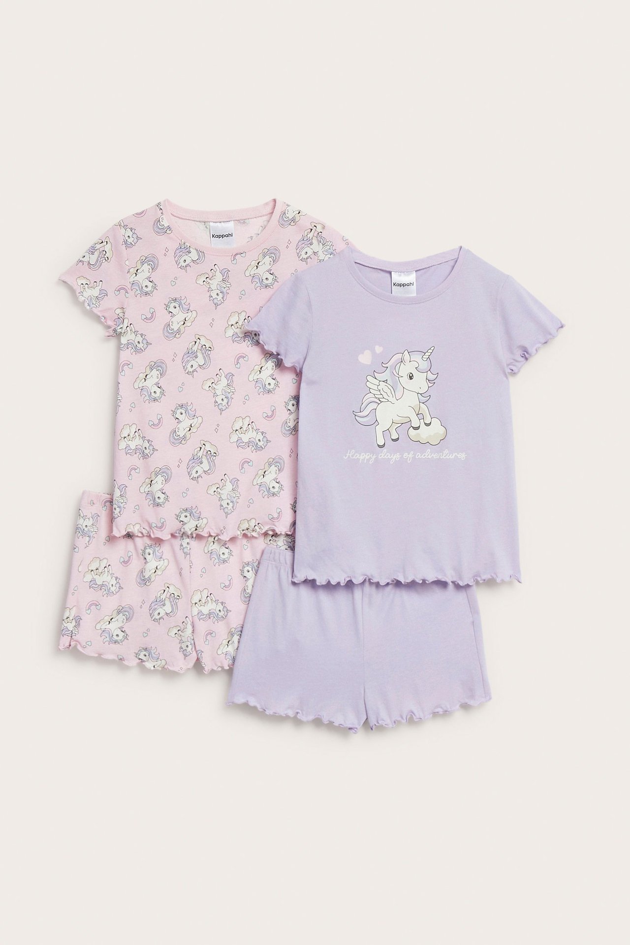 Widok z przodu: Dwie piżamy bawełniane dla dzieci. Jeden jasnoliliowy zestaw w jednorożce, drugi różowy w jednorożce.