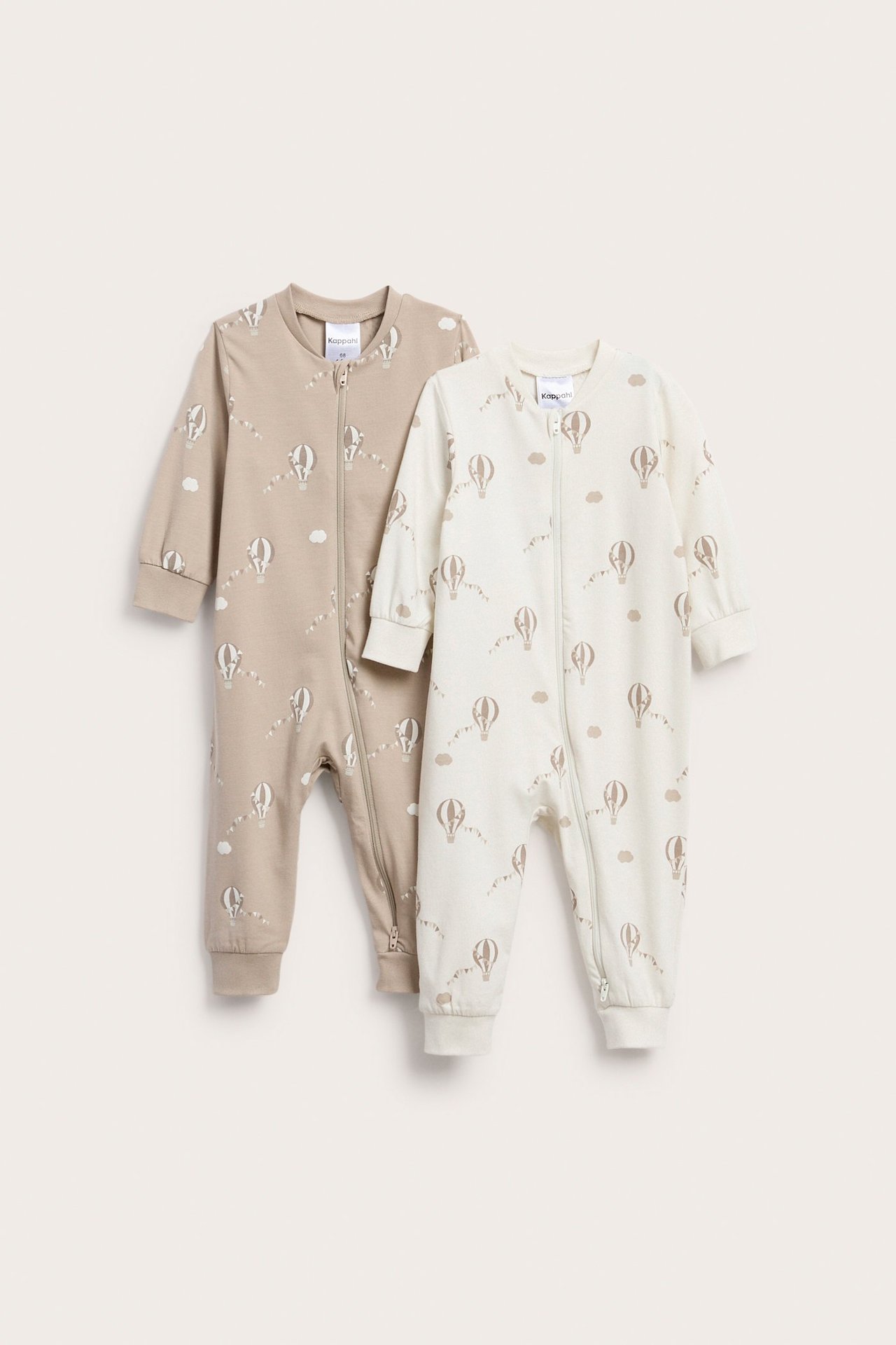 Frontutsikt: To babydresser, lysebrun og off-white, med luftballongmønster og toveis glidelåser.