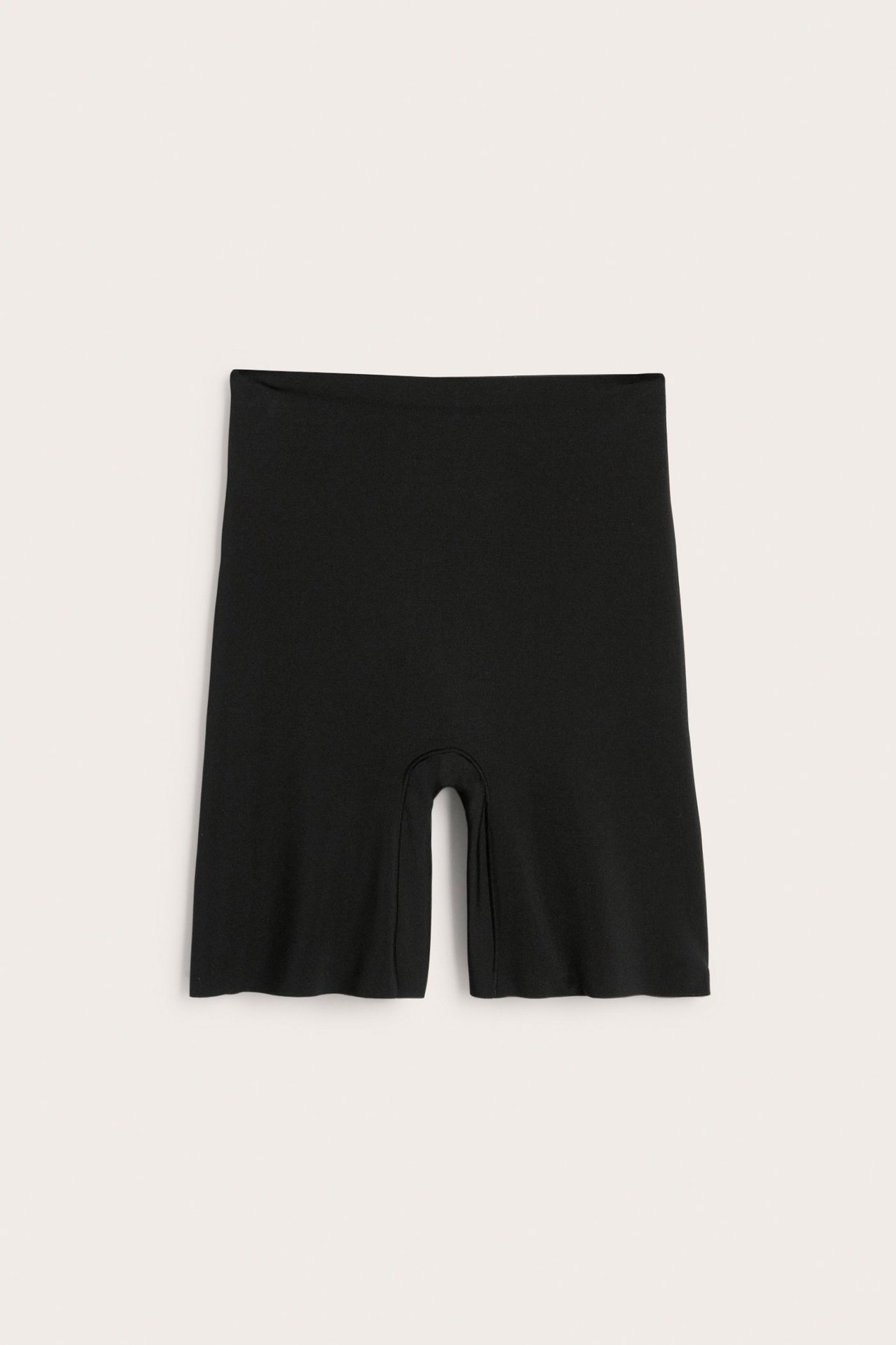 Edestä mustat saumattomat korkeavyötäröiset muotoilevat shortsit sileästä polyamidi-elastaanisekoitteesta.
