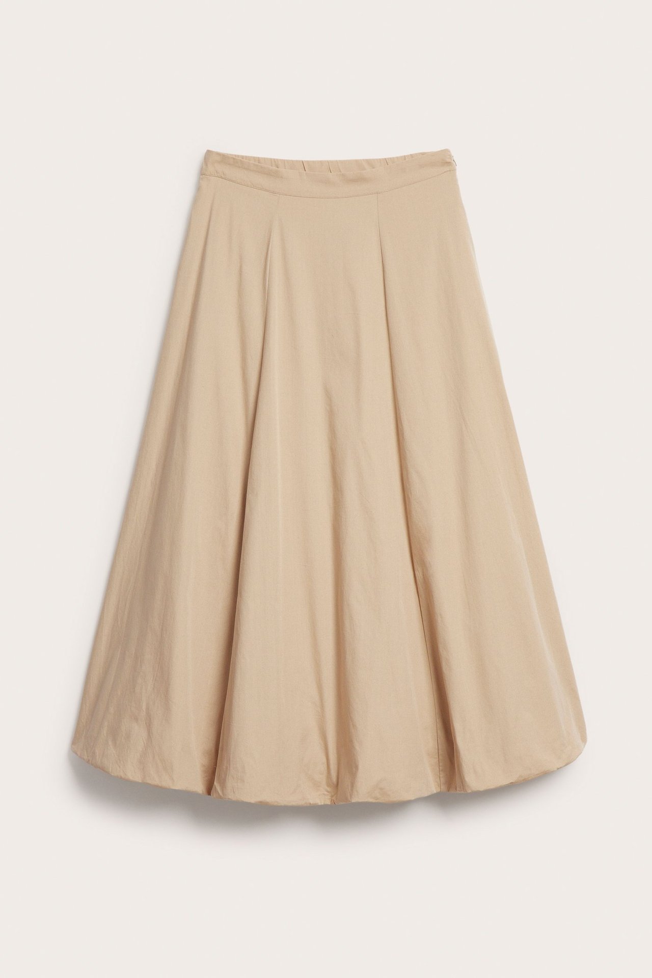 Edestä kuvattu pitkä beige puuvillapopliinista valmistettu pallohame.