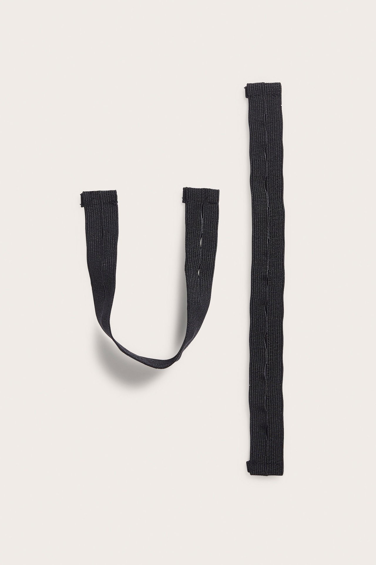 Mustat elastiset jalkaholkit haalareihin ja housuihin, sopii Kaxs Proxtec.