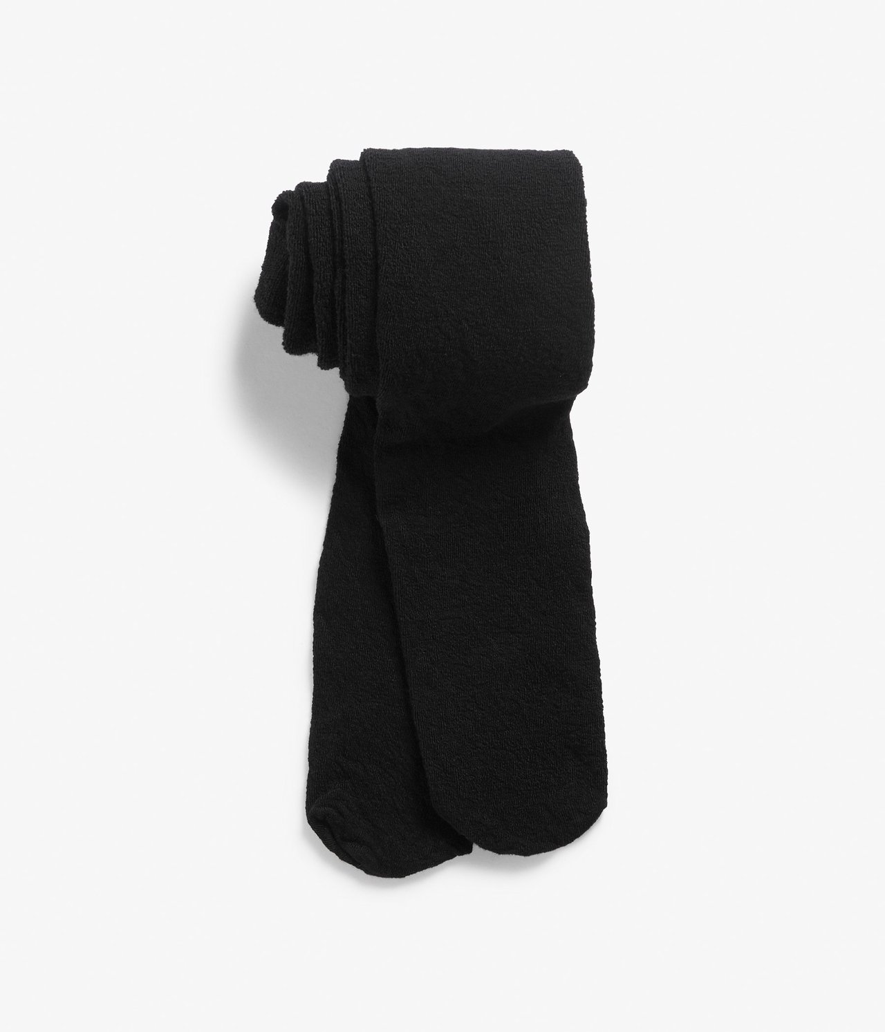 Edestä näkymä taitetuista mustista sileäneulotuista villasekoitetrikoista korkealla vyötäröllä.